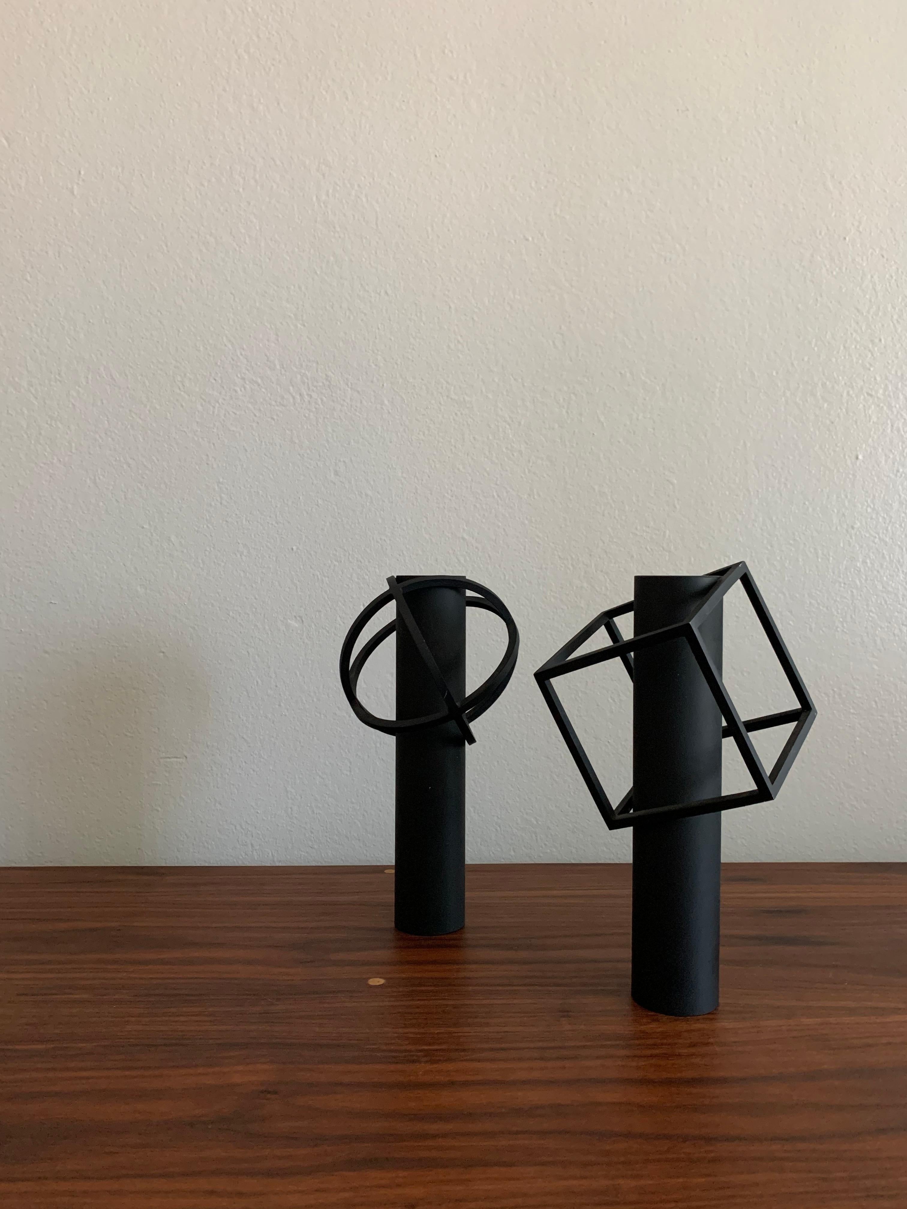 Y·M·D vases in die cast iron by Takenobu Igarashi for Takenaka Works Co., Ltd. circa 1992. 

“I wanted to create a flower vase that suggests a flower even in its absence.” - Igarashi. 

Dimensions: 
Sphere W 130 x H 241 x D 130 mm
Cube W 140 x