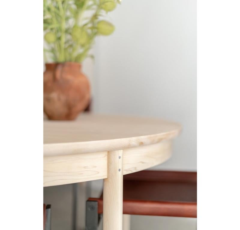 The Ynez Round Dining Table is handmade locally in Los Angeles, California. The solid wood maple top is joined and cut to size featuring a demi bullnose edge that runs along the underside of the top. The circular top is supported by a solid wood
