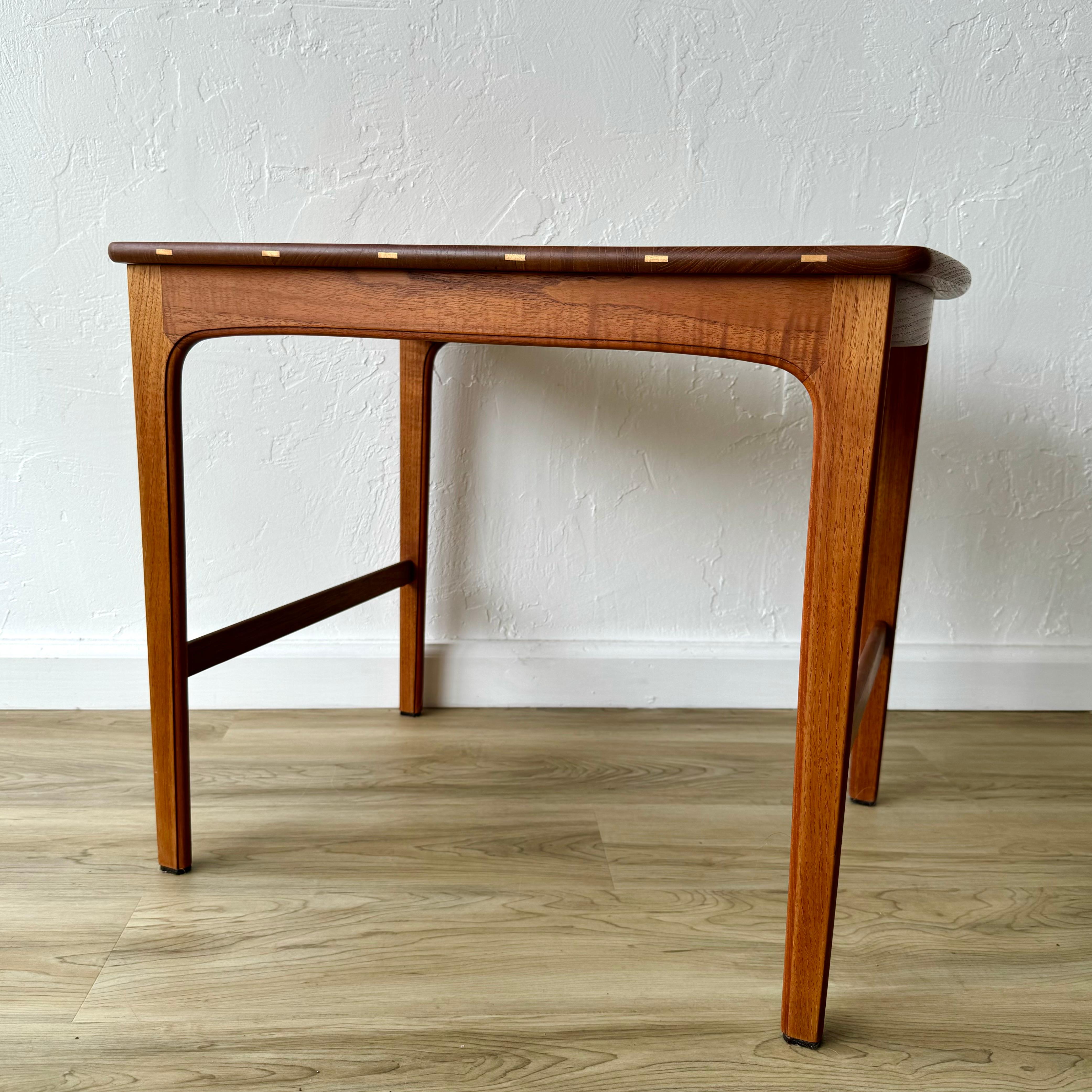 A fantastic pair of solid wood tables designed by Yngvar Sandstrom. Undoubtedly some of the highest quality craftsmanship I’ve seen from Scandinavia. Solid teak tops reinforced with splines in beechwood. A haunched side rail meets the leg joints.