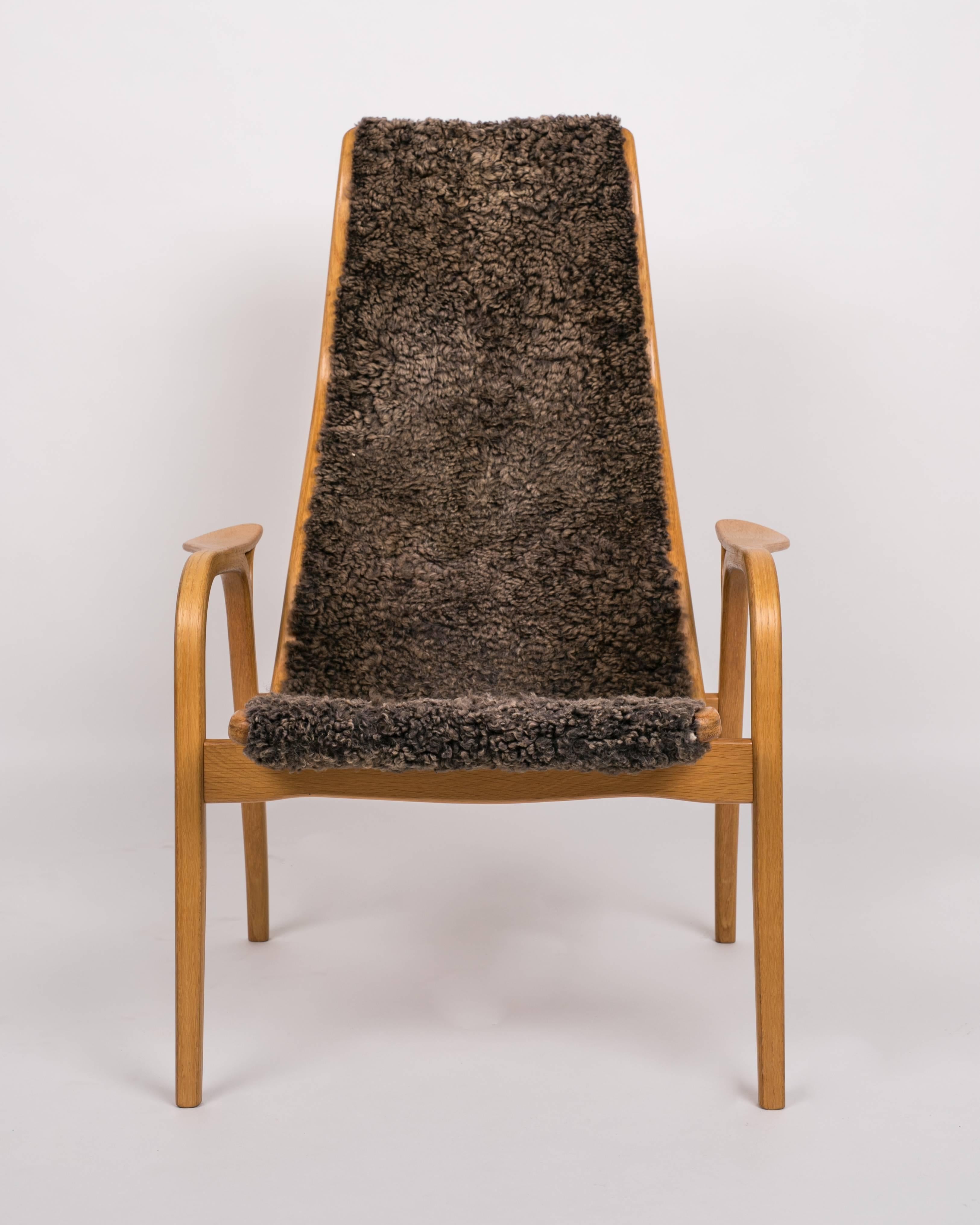 Swedish Yngve Ekström Lamino Chair and Ottoman with Sheepskin Upholstery
