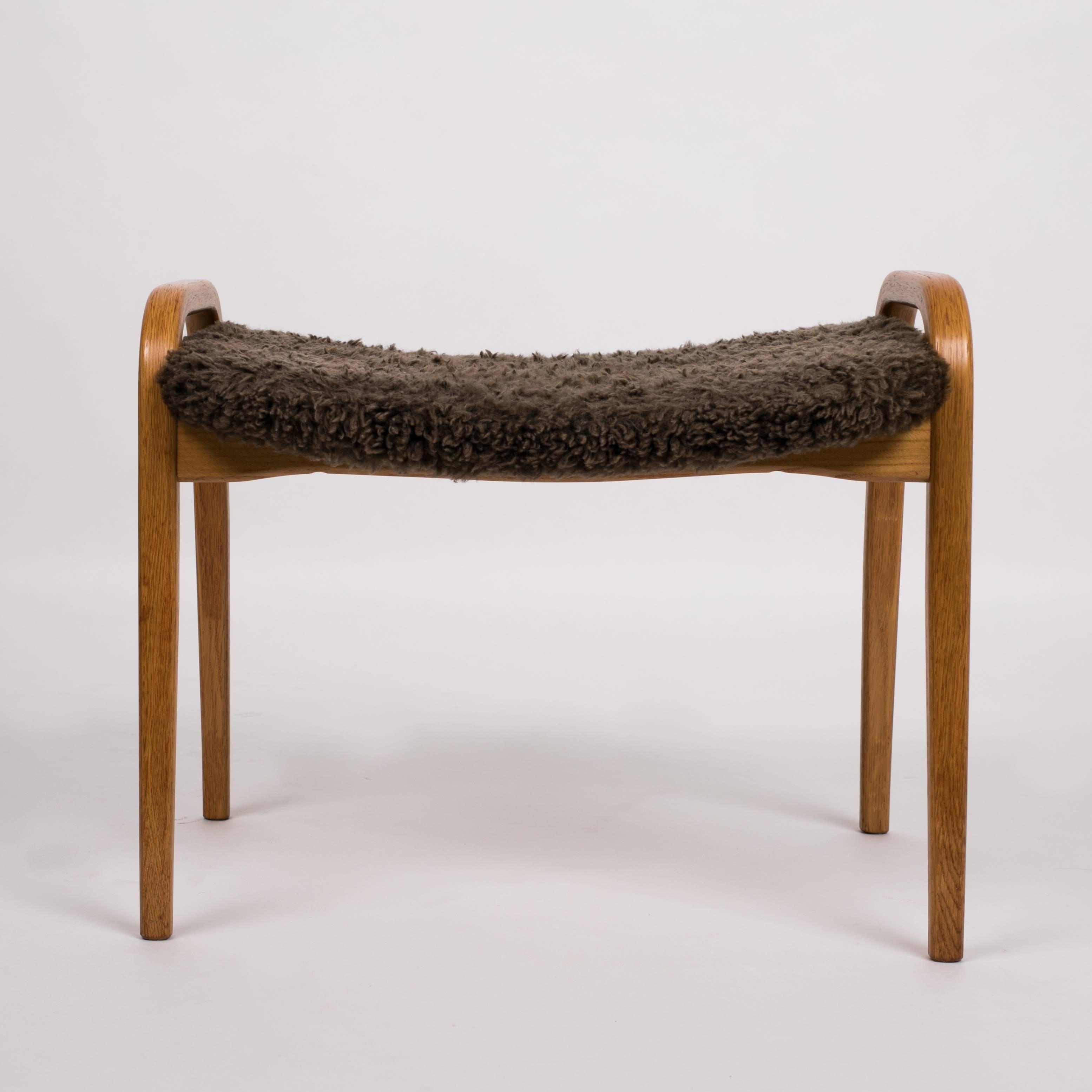 Oak Yngve Ekström Lamino Chair and Ottoman with Sheepskin Upholstery