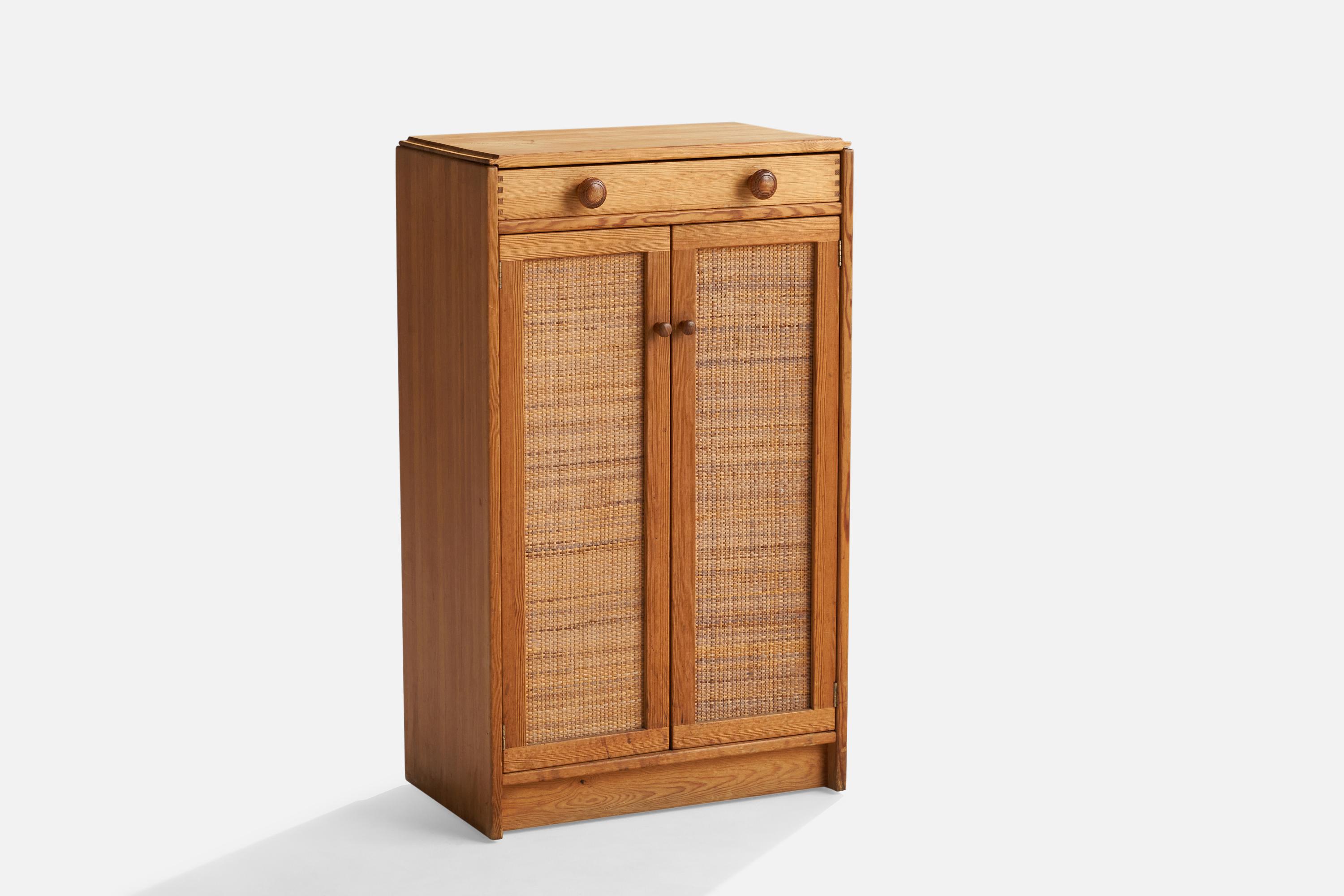 A pine and rattan cabinet designed by Yngve Ekström, Sweden, 1960s.