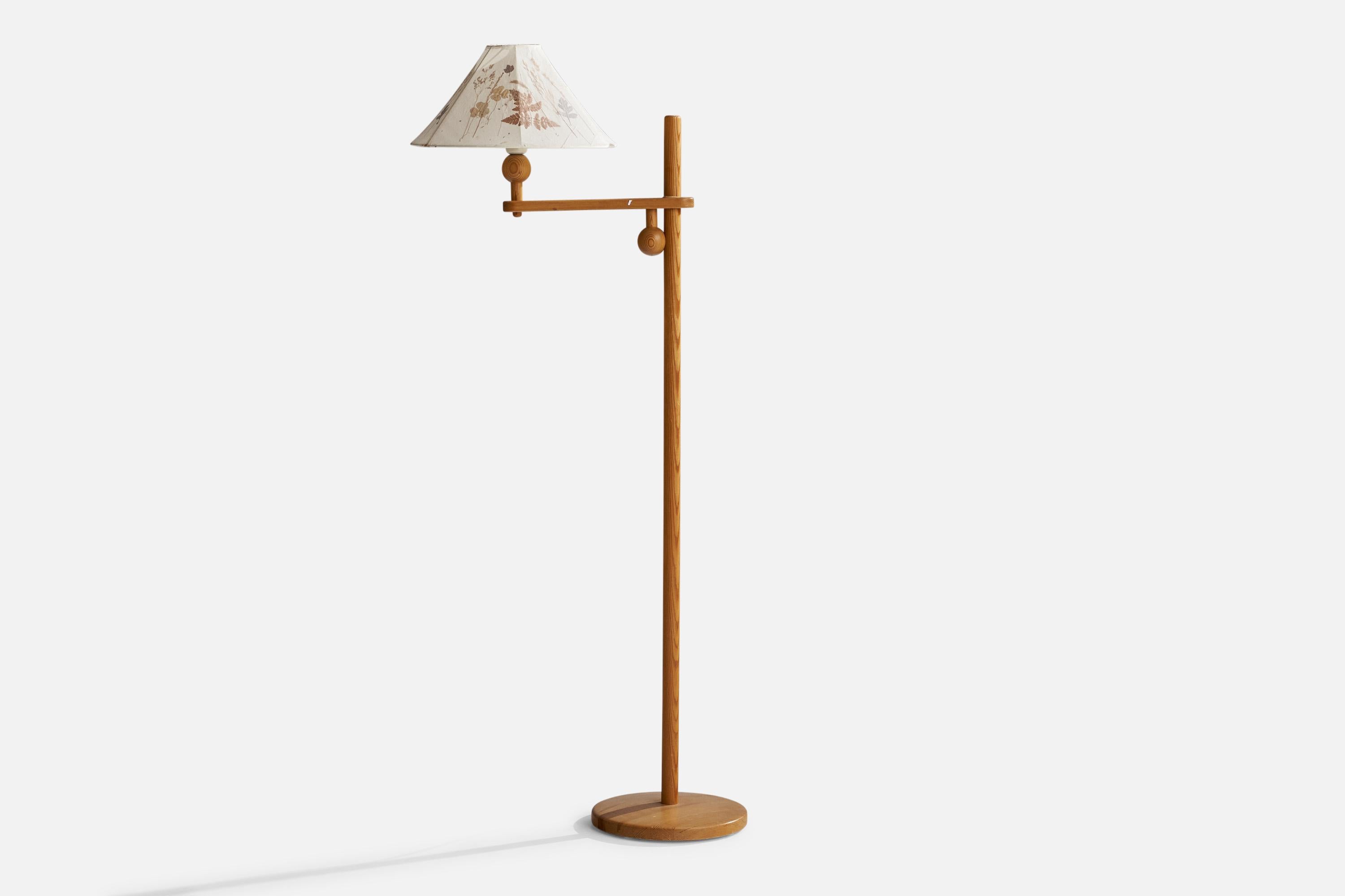 An adjustable pine and floral-printed paper floor lamp designed by Yngve Ekström, Sweden, 1970s.

Overall Dimensions (inches): 53” H x 14” W x 23” D
Stated dimensions include shade.
Bulb Specifications: E-26 Bulb
Number of Sockets: 1
All lighting