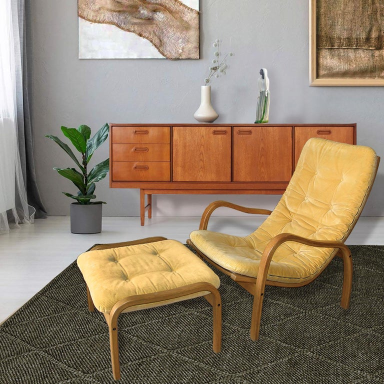 Yngve Ekstrom chair and ottoman by Swedese. Sunflower yellow corduroy covering. Frames made of bent birch. Marked 
