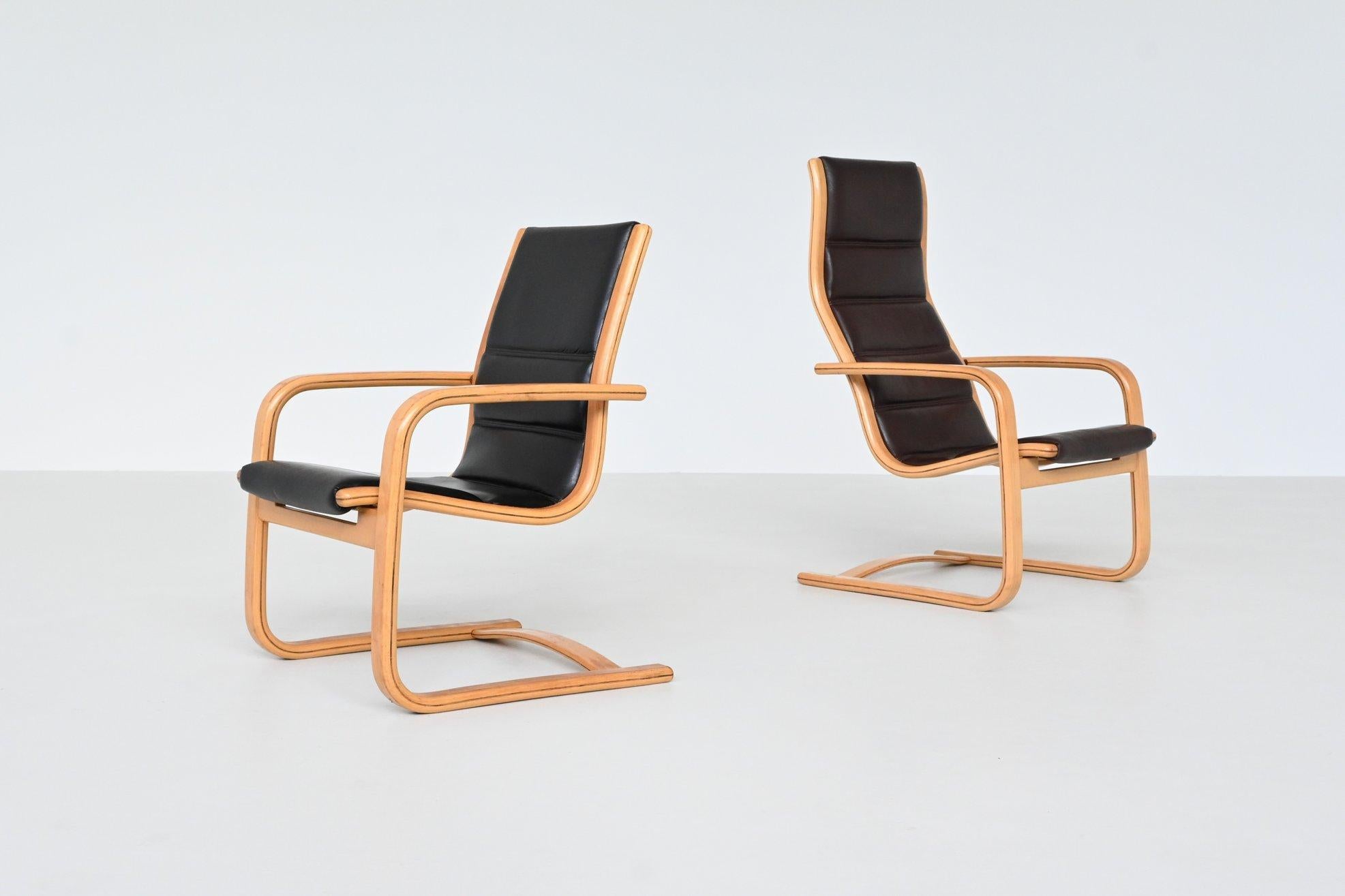 Beautiful shaped pair of lounge chairs model “Lamello” designed by Yngve Ekström for Swedese, Sweden 1960. Wonderfully curved frame made of solid beech with the the high-quality original leather cover in black and brown. The chairs have perfect