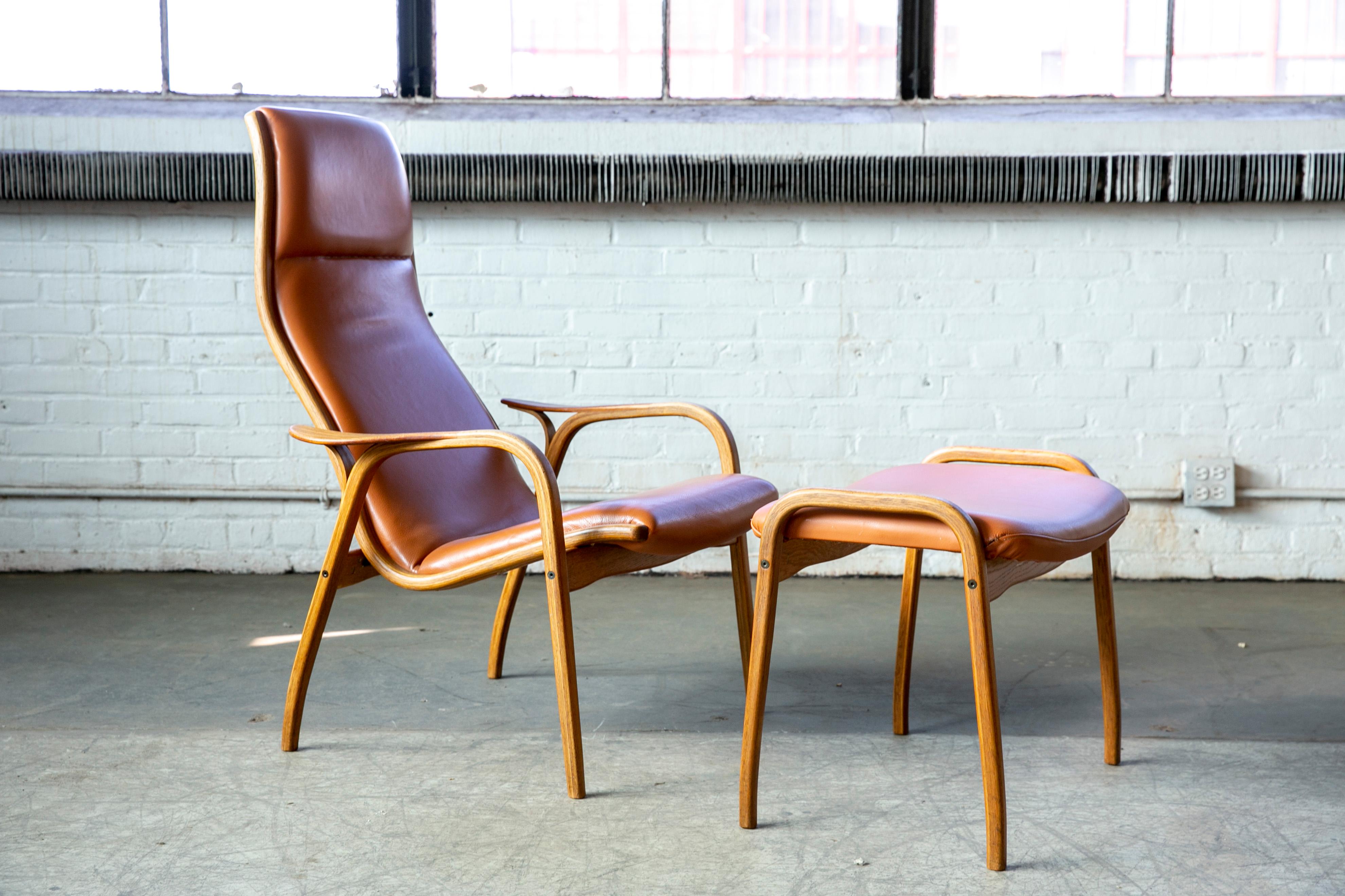 Yngve Ekstrom Lamino Chair in leather with ottoman in Laminated Walnut with Teak 4