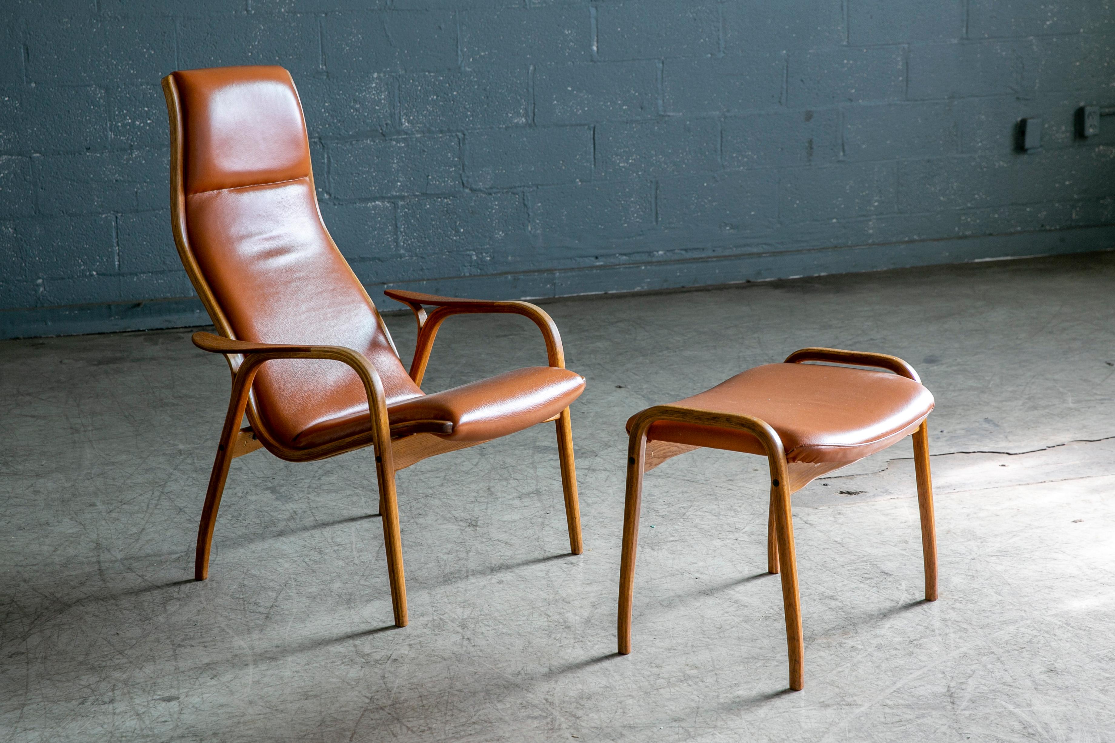 Mid-Century Modern Yngve Ekstrom Lamino Chair in leather with ottoman in Laminated Walnut with Teak