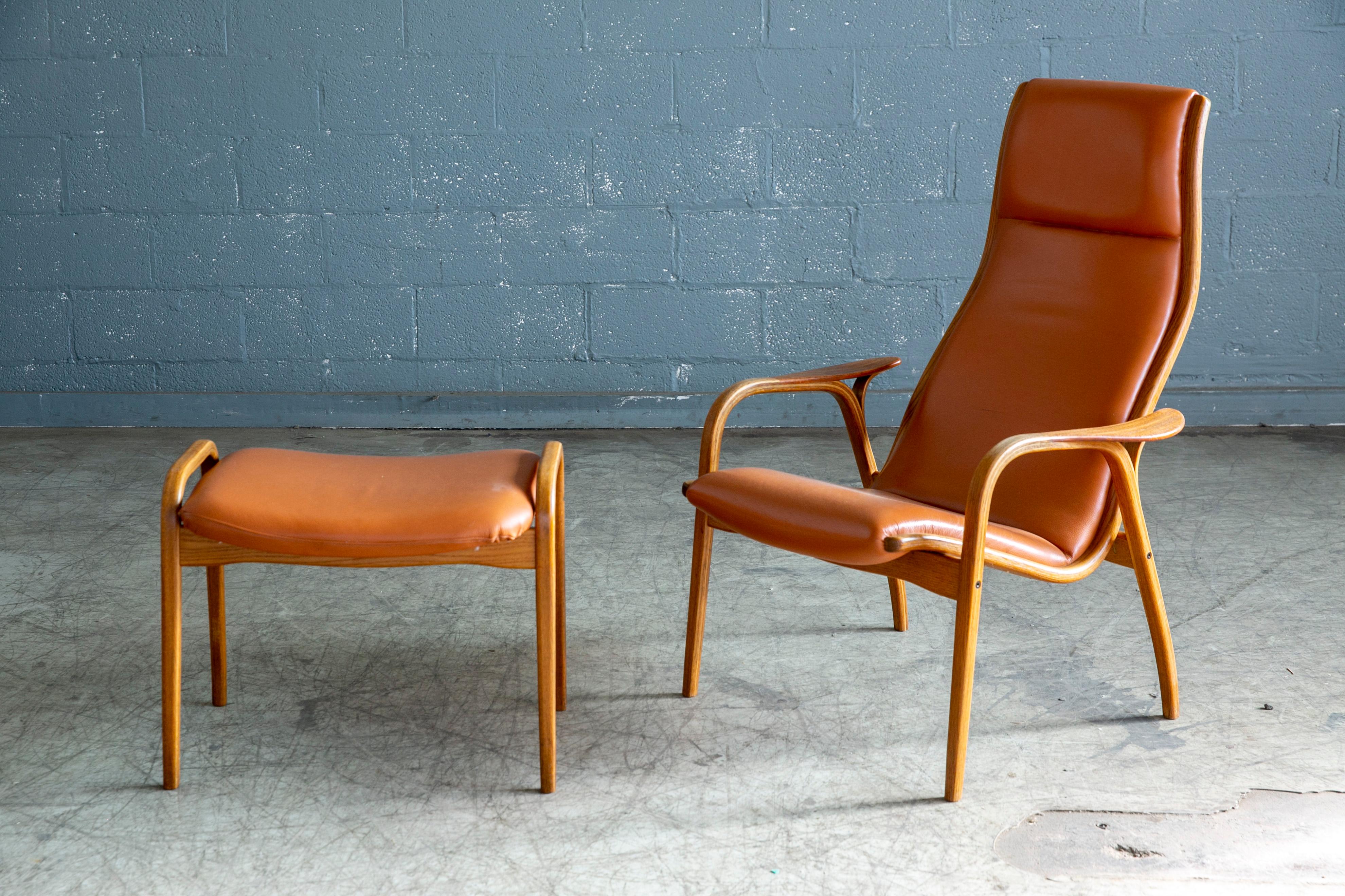 Yngve Ekstrom Lamino Chair in leather with ottoman in Laminated Walnut with Teak In Good Condition In Bridgeport, CT