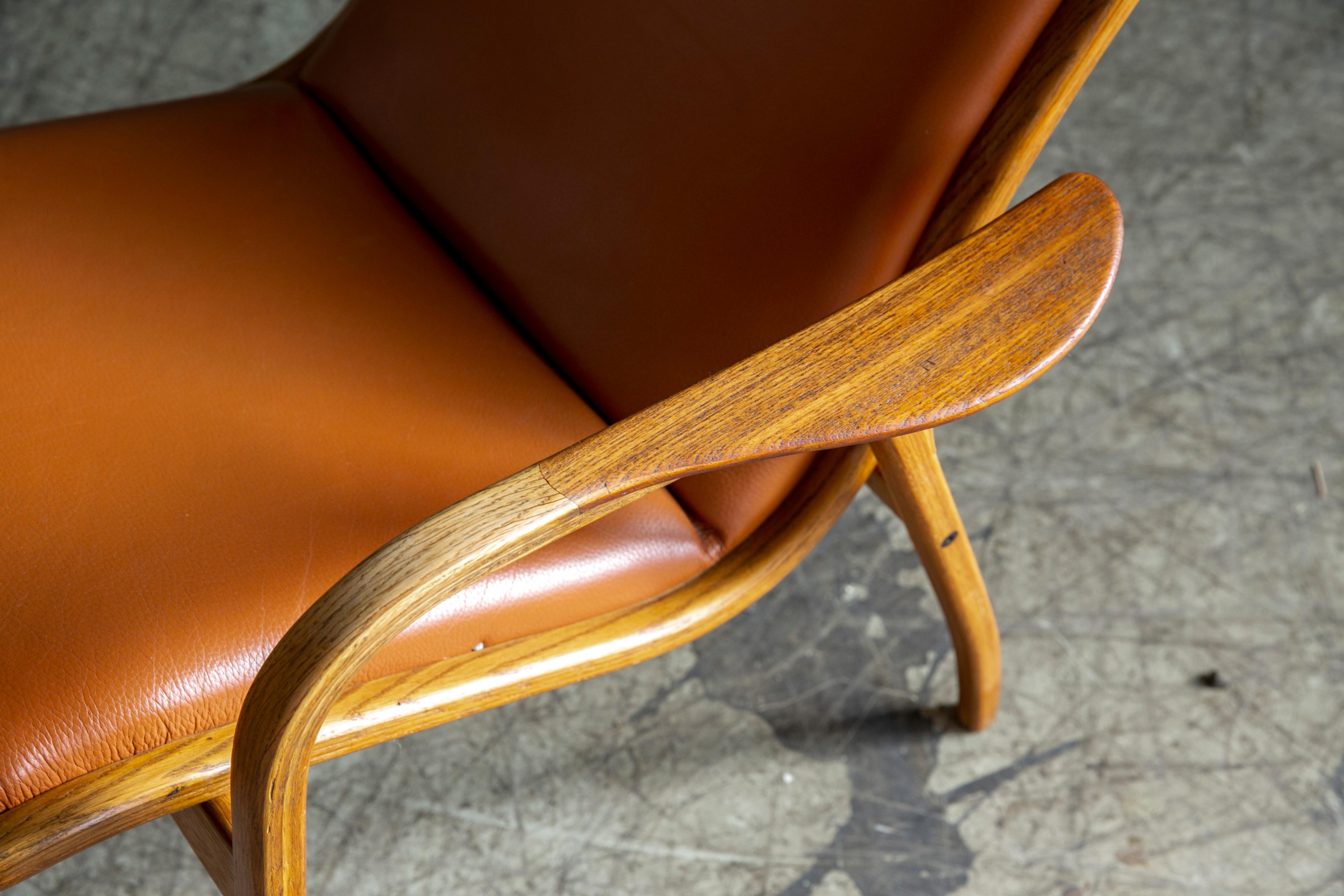 Mid-20th Century Yngve Ekstrom Lamino Chair in leather with ottoman in Laminated Walnut with Teak