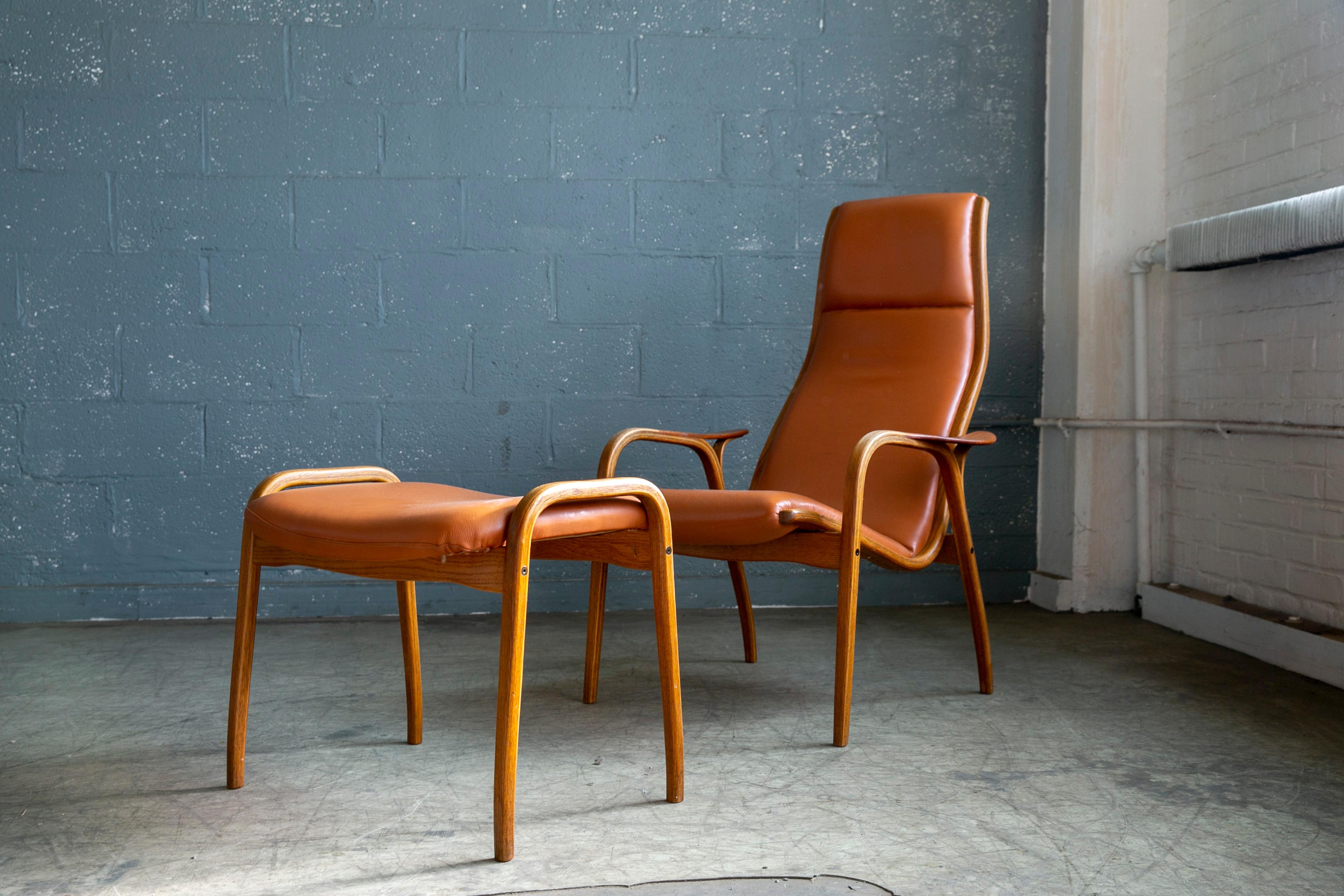 Yngve Ekstrom Lamino Chair in leather with ottoman in Laminated Walnut with Teak 1