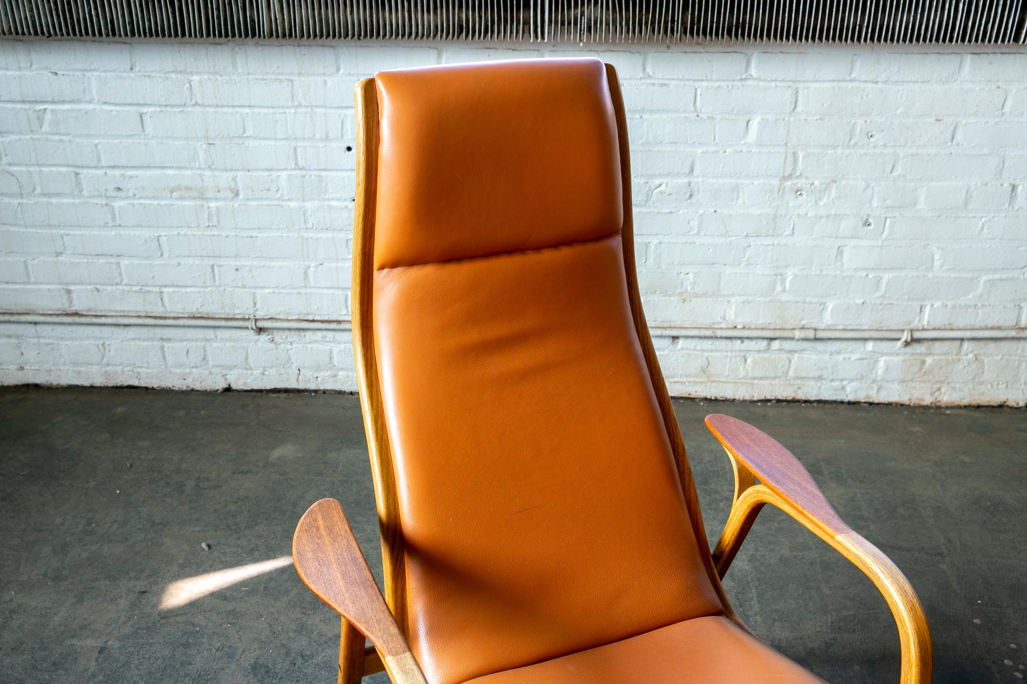 Yngve Ekstrom Lamino Chair in leather with ottoman in Laminated Walnut with Teak 2