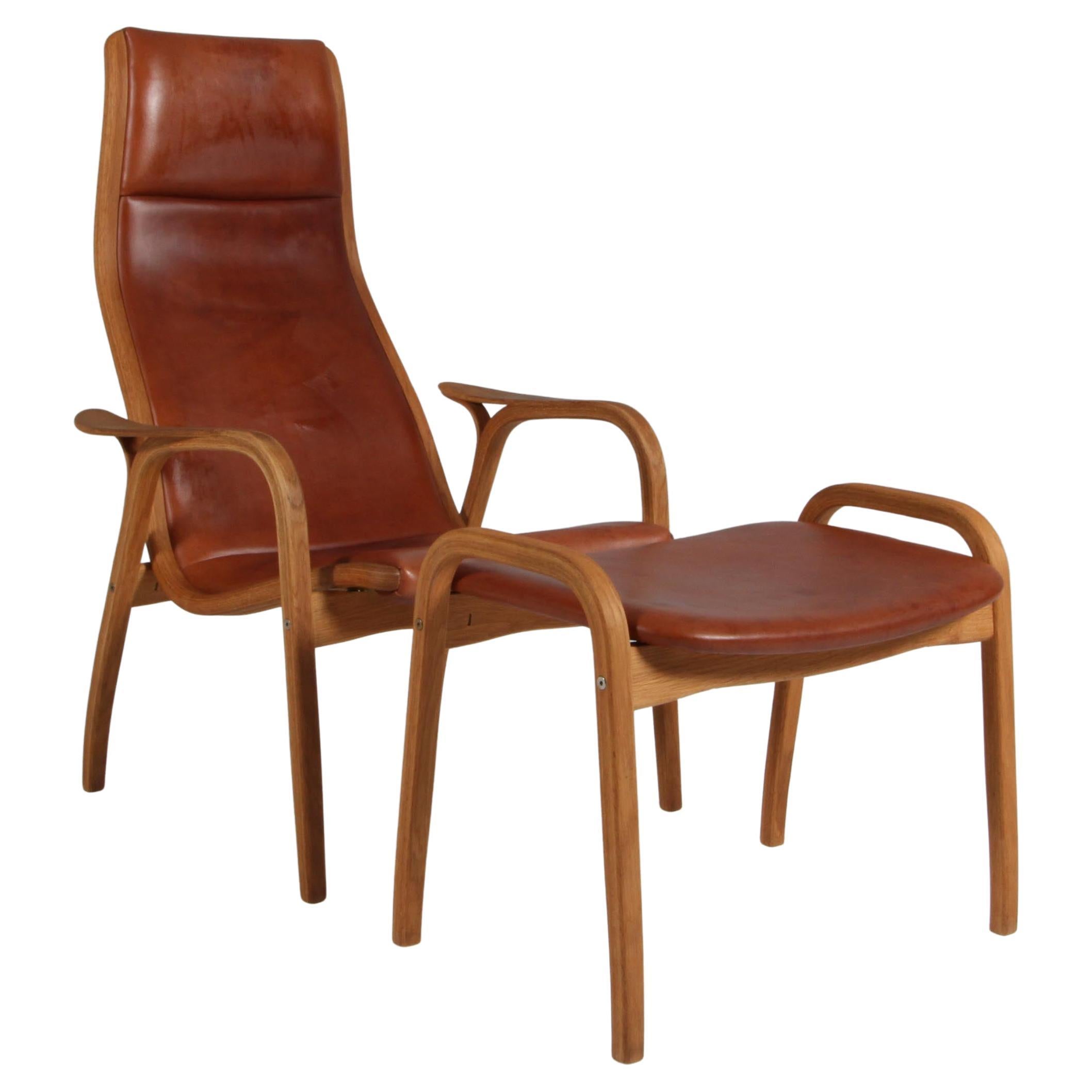 Yngve Ekström, "Lamino" Lounge Chair with ottoman, patinated leather For Sale