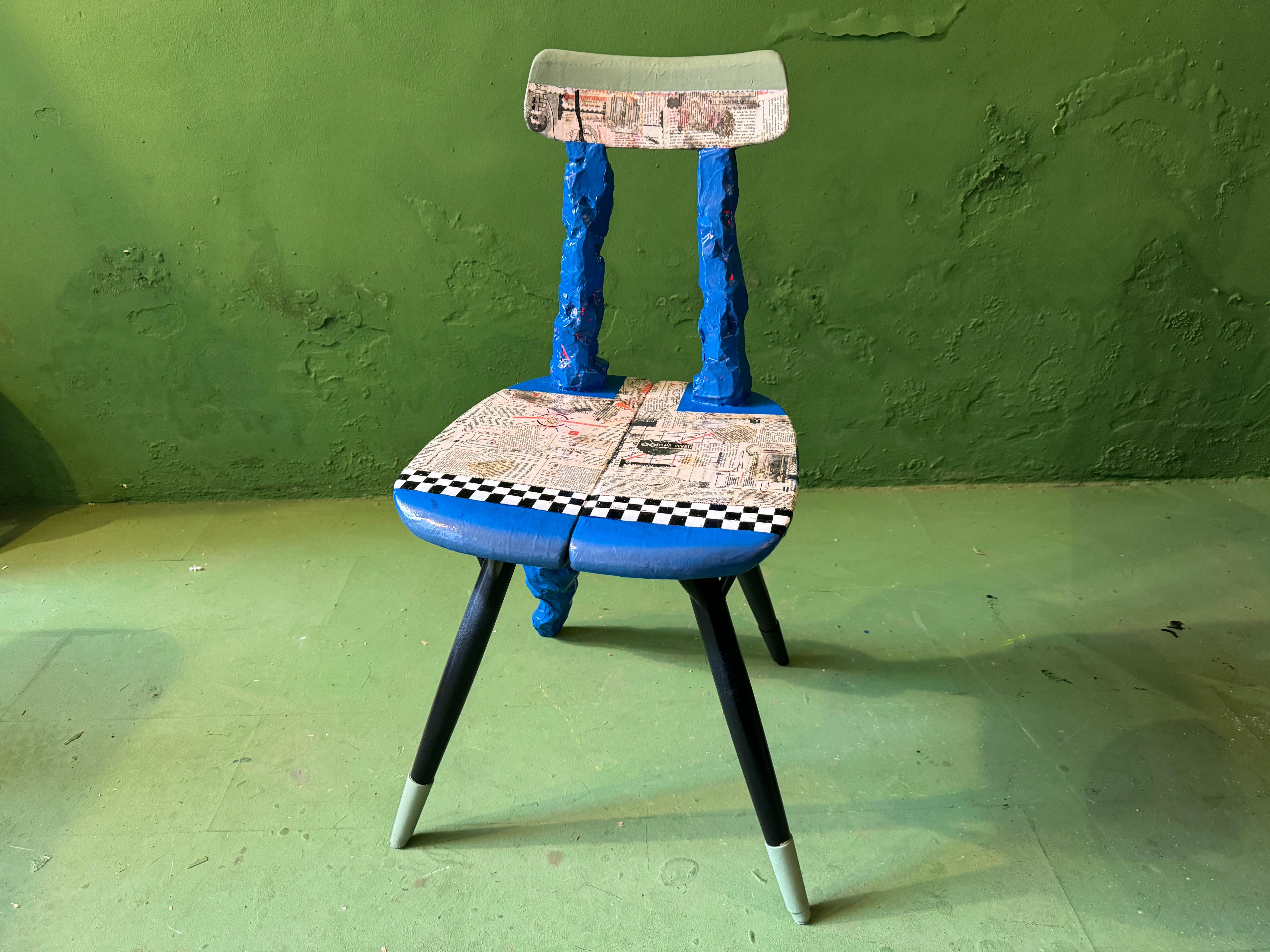Ynve Ekströms famous chair re-visited with an artistic level never seen before. Paper mache, lacquere, color and old russian newspaper

Teak stool/ table, gold plated, painted, lacquered in hogh gloss, carved and backrest added. Original title