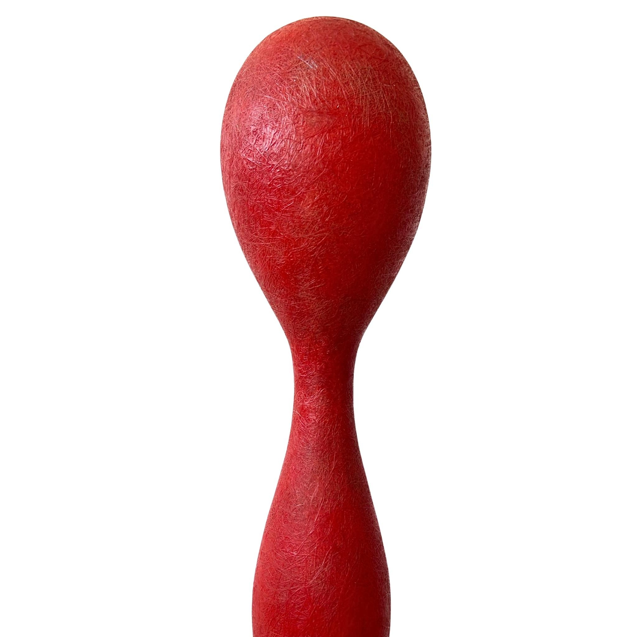 Sculptural floor lamp designed by Guglielmo Berchicci for Italian lighting brand Kundalini in the 1990s. The ‘Yoga’ lamp is made from fiberglass reinforced resin with a matte red finish. Its elongated biomorphic form gives off a soft ambient glow