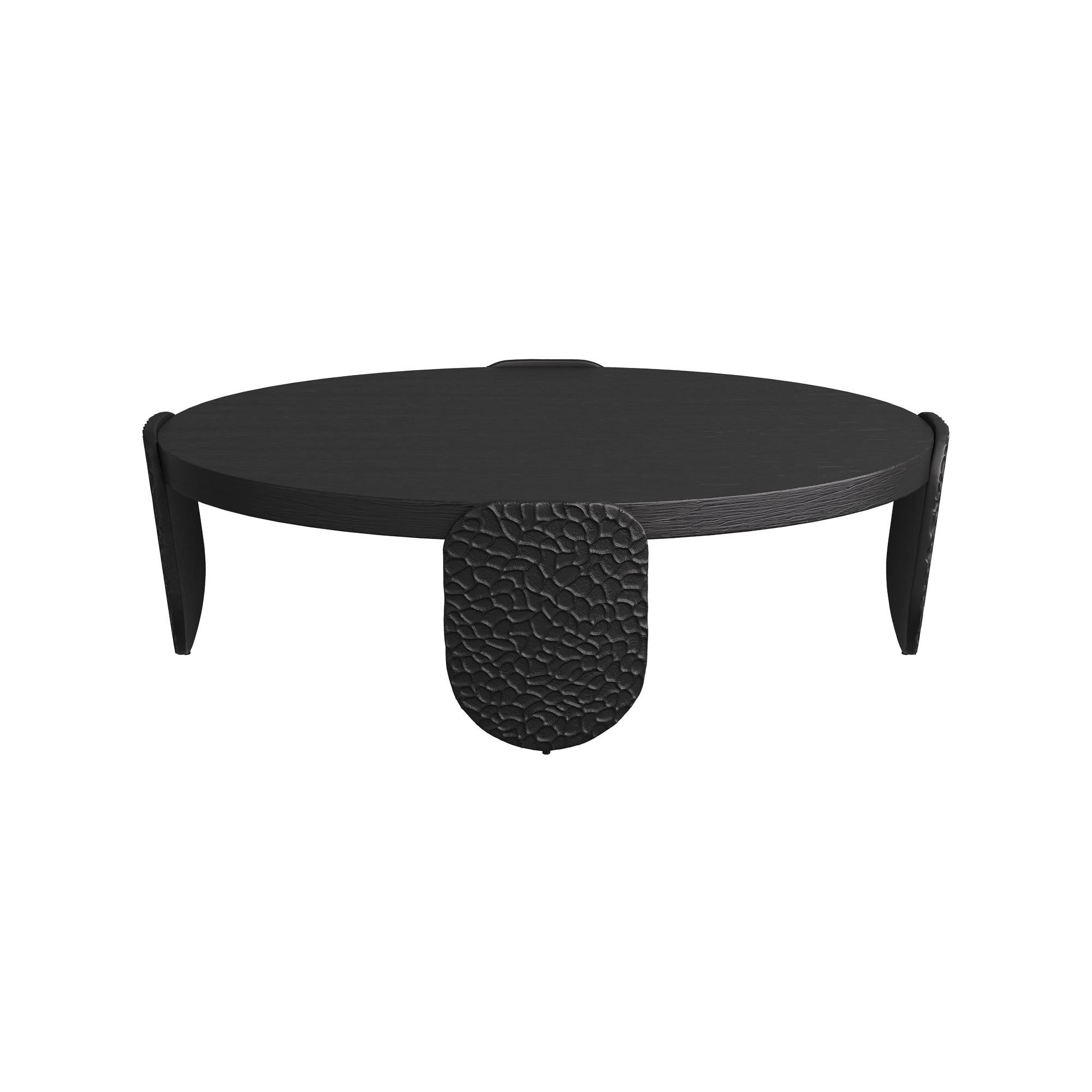 Striking a balance between modern simplicity and organic warmth, this contemporary table is thoughtfully designed to complement a variety of interior styles. Its clean, minimalist silhouette is elevated by the bold use of materials and shape. The