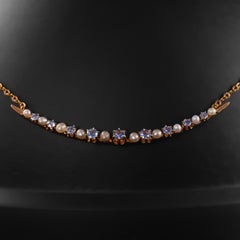 Yogo Sapphire & Natural Pearl Crescent Pendant, Circa 1900
