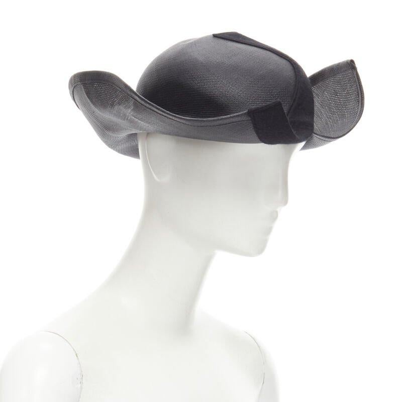 YOHJI YAMAMOTO 1980's Vintage black coated raffia curled  brim fedora hat 58cm
Reference: CRTI/A00652
Brand: Yohji Yamamoto
Designer: Yohji Yamamoto
Collection: 1980s
Material: Raffia
Color: Black
Pattern: Solid
Extra Details: Split brim with wool