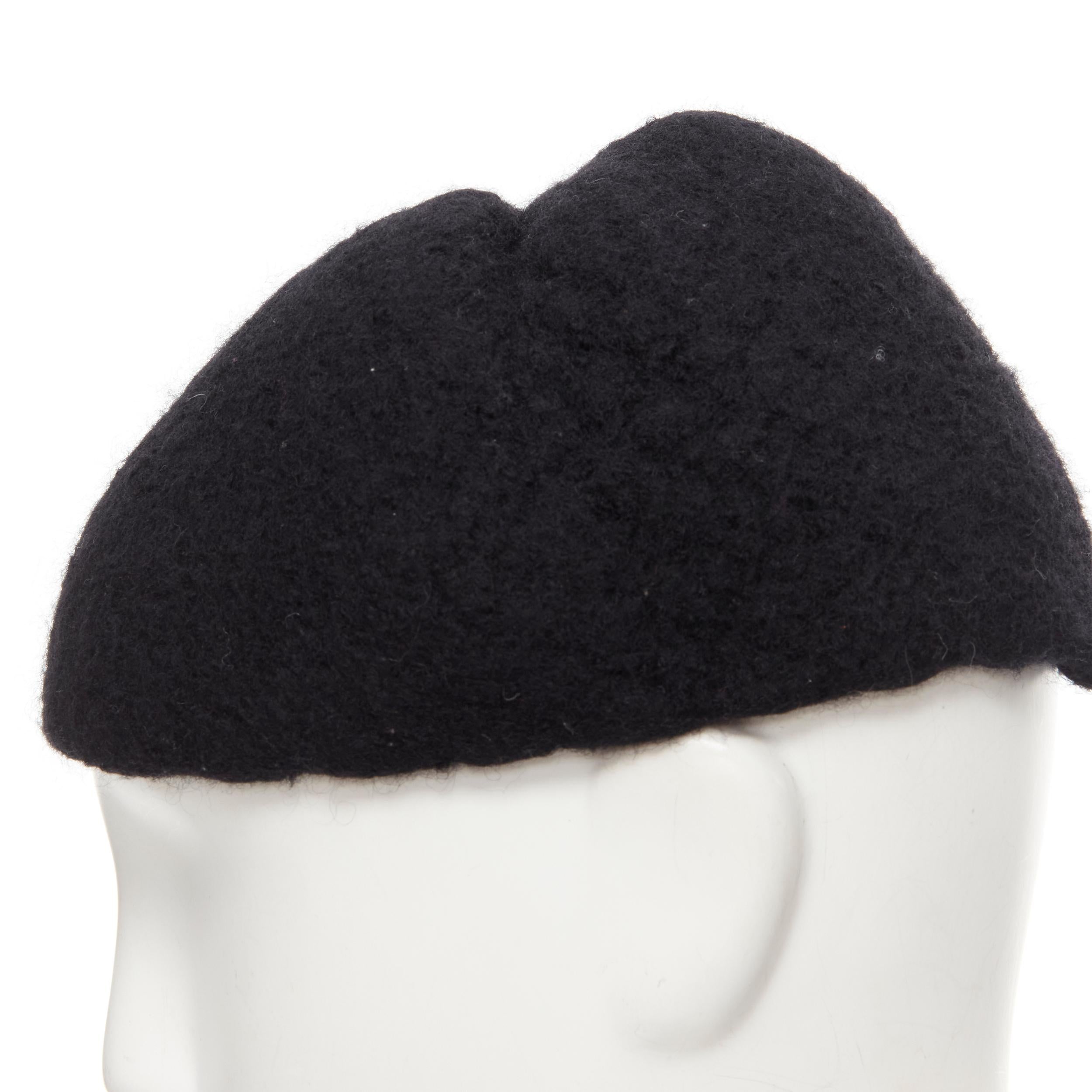 YOHJI YAMAMOTO 1990's Vintage black heavy boiled wool pinched top beanie cap 
Reference: CRTI/A00656 
Brand: Yohji Yamamoto 
Material: Wool 
Color: Black 
Pattern: Solid 
Extra Detail: Pinched seam at top to give structured to hat when worn. 
Made