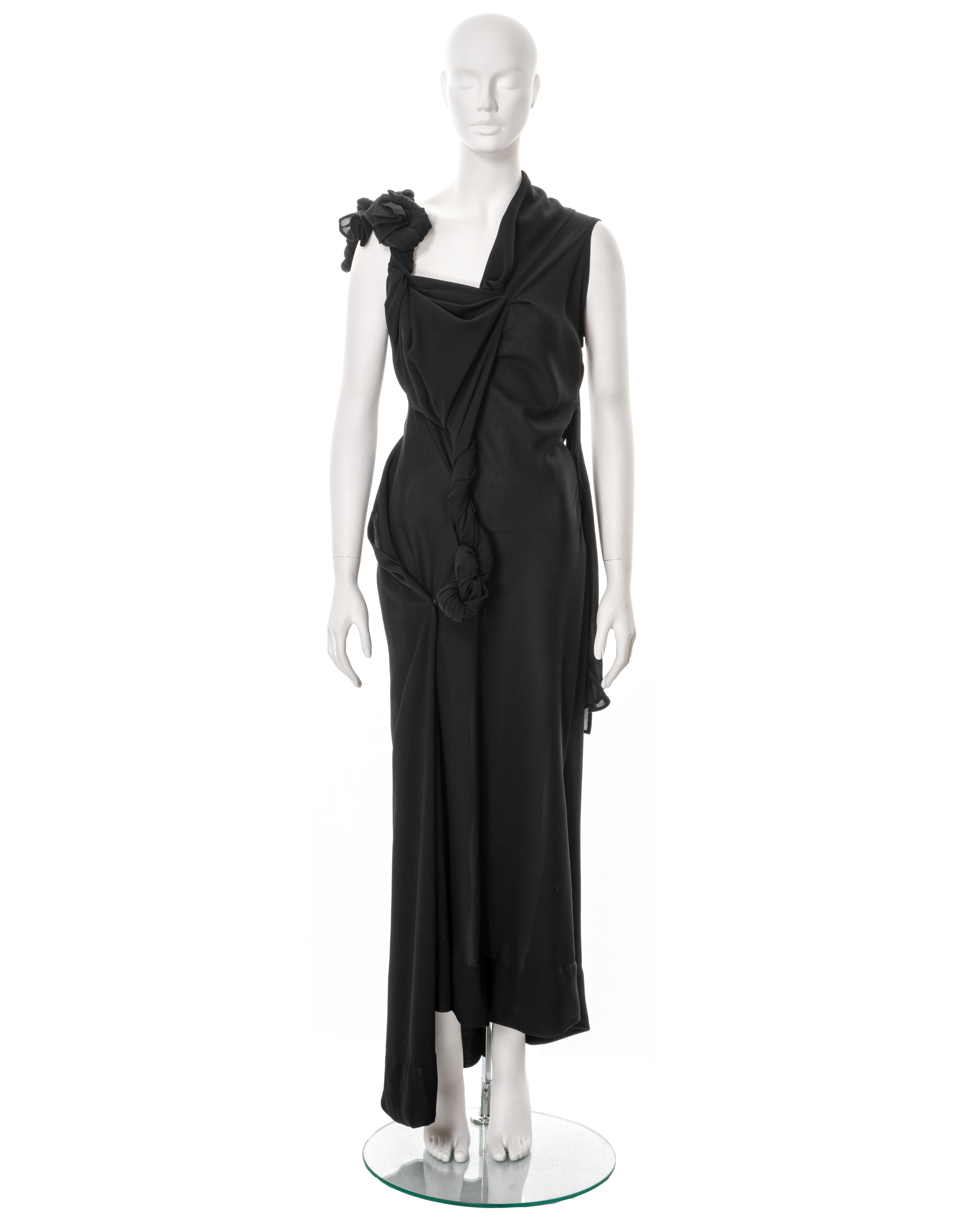 ▪ Yohji Yamamoto evening dress
▪ Sold by One of a Kind Archive
▪ Spring-Summer 1998
▪ Constructed from black polyester; twisted and draped around the bodice 
▪ Rare runway piece
▪ Size Small
▪ Made in Japan

All photographs in this listing EXCLUDING