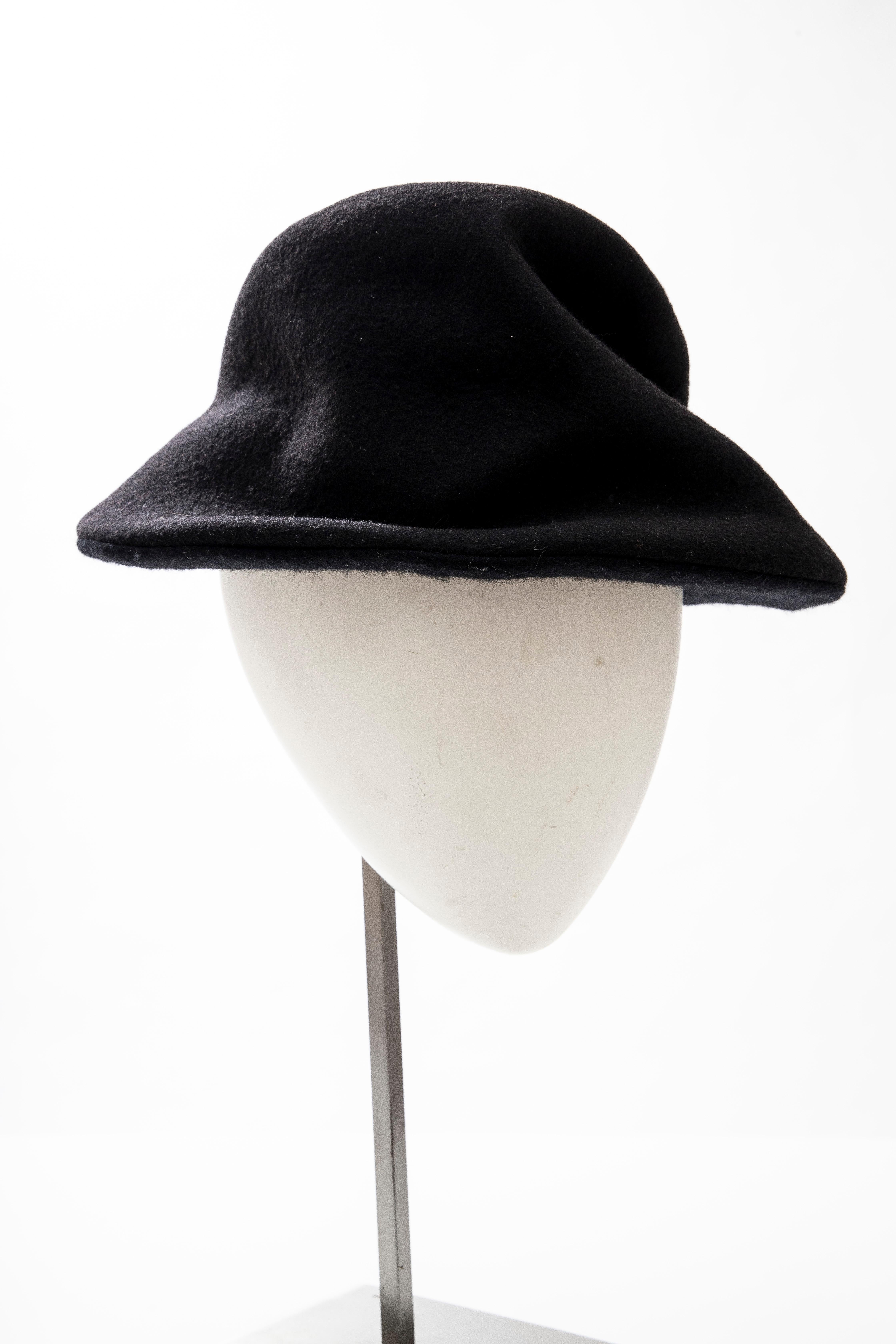  Yohji Yamamoto black asymmetrical felted wool hat with brim.

Circumference: 25
