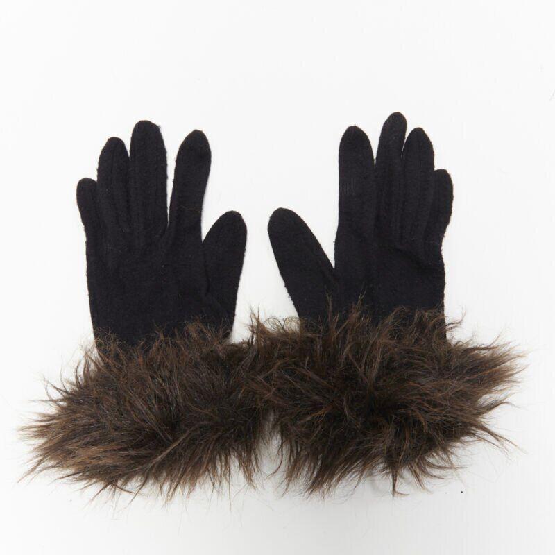 YOHJI YAMAMOTO black washed wool brown faux fur trimmed winter gloves
Reference: CRTI/A00253
Brand: Yohji Yamamoto
Designer: Yohji Yamamoto
Model: Faux fur gloves
Material: Wool
Color: Black, Brown
Pattern: Solid
Extra Details: Faux fur
