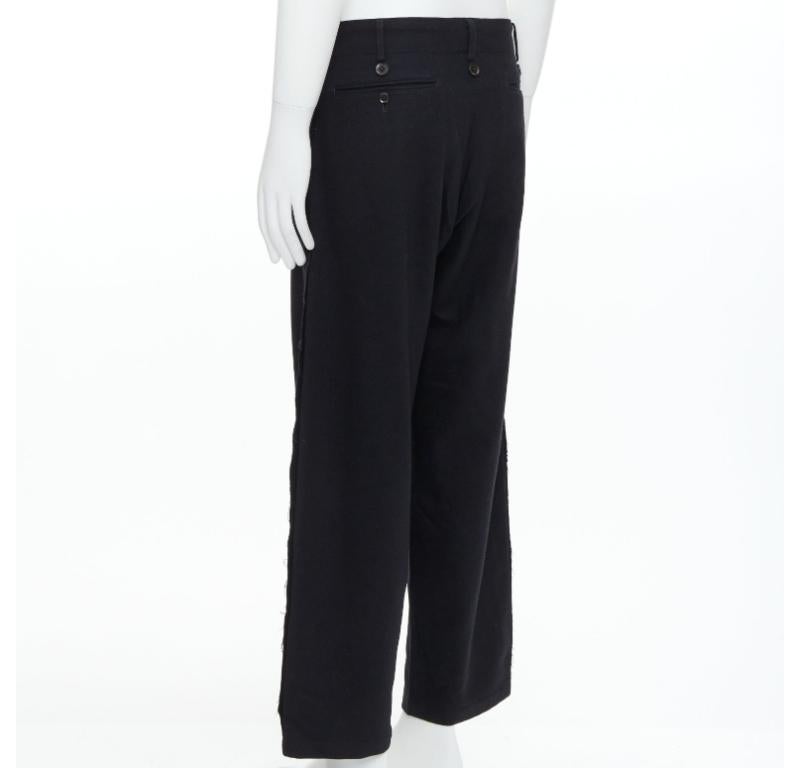 YOHJI YAMAMOTO Pantalones con bordes en crudo adornados con botones en mezcla de lana negra JP2 M en venta 1