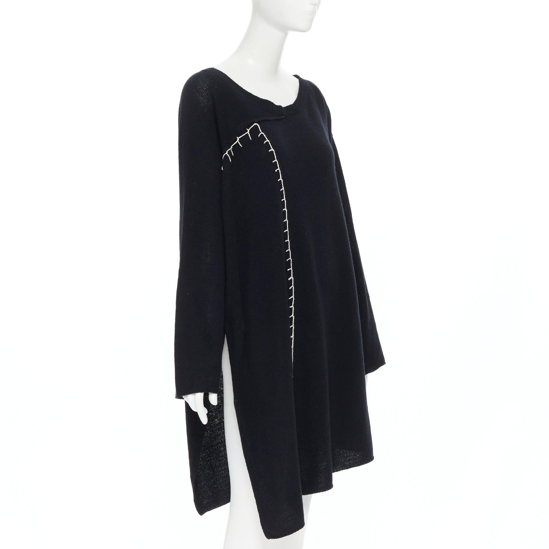 YOHJI YAMAMOTO black wool cotton white whipstitch open side tunic sweater JP2
Reference: AEMA/A00032
Brand: Yohji Yamamoto
Designer: Yohji Yamamoto
Material: Wool
Color: Black
Pattern: Solid
Extra Details: Whipstitch detail. Scoop neck. Slit on