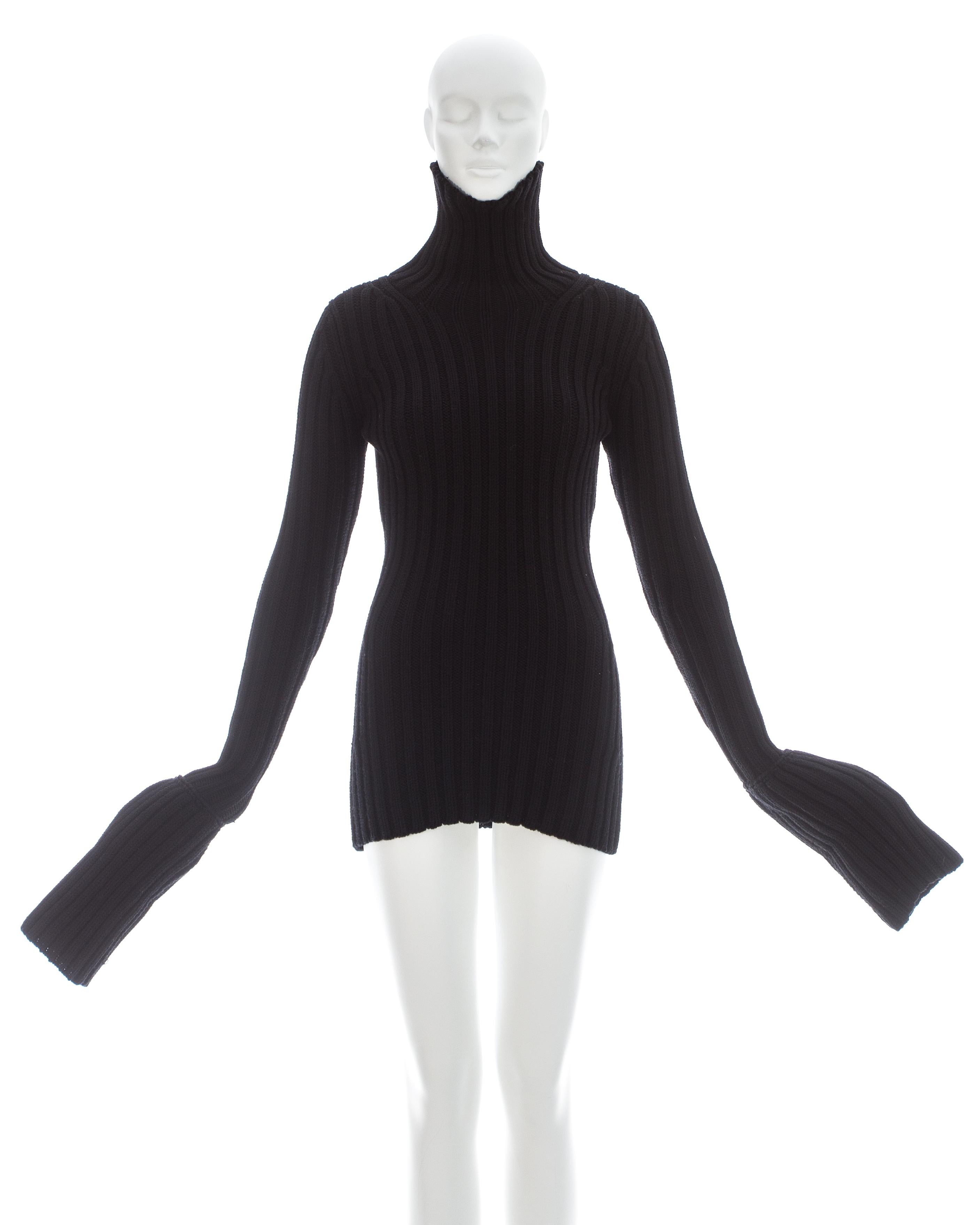 Yohji Yamamoto; Black wool knitted turtle neck sweater with extra long turn-up cuffs 

Fall-Winter 1998