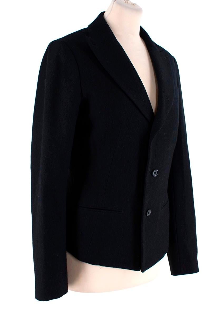 Yohji Yamamoto Black Wool Single-Breasted Blazer
 

 - Black wool single-breasted blazer in the Maisons signature shruken style
 - Peaked lapels, two front welt pockets
 - Button finished martingale
 - Partially lined
 - Style with a dramatic skirt