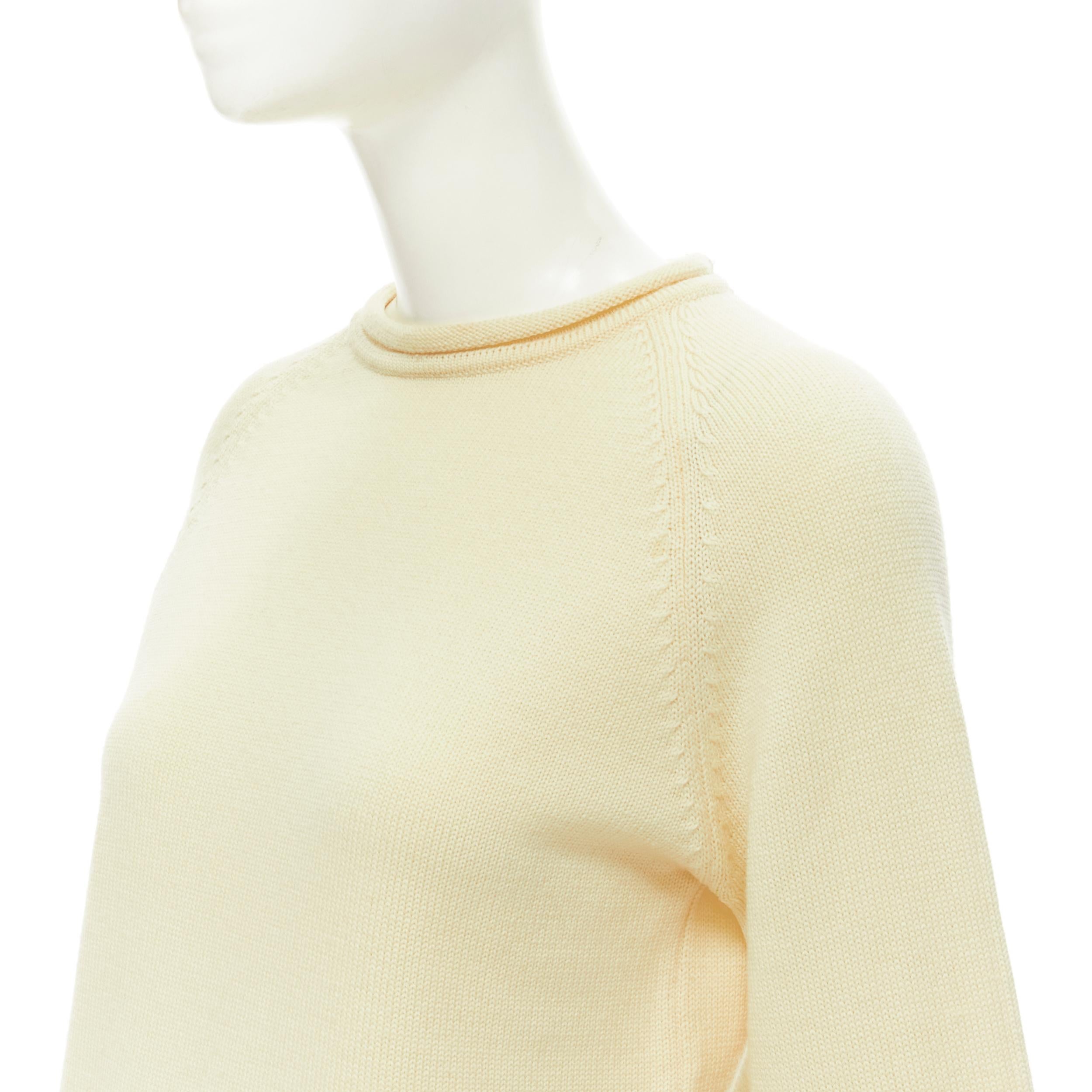 YOHJI YAMAMOTO cream beige 100% wool rolled edge wide sleeve sweater M 
Reference: AEMA/A00063 
Brand: Yohji Yamamoto 
Material: Wool 
Color: Cream 
Pattern: Solid 
Extra Detail: Rolled neck and rolled detailing at cuff and hem. 

CONDITION: