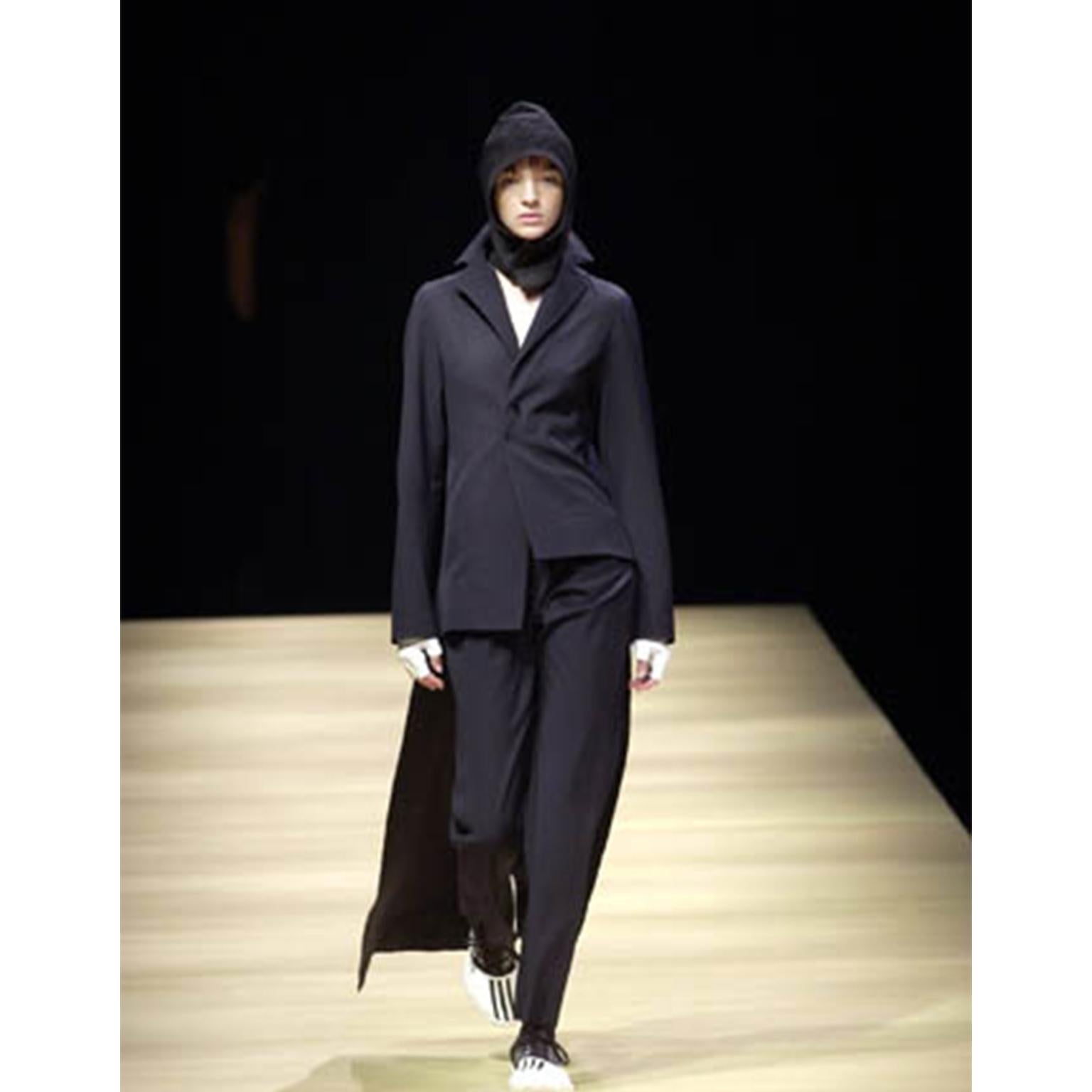 This vintage Yohji Yamamoto Fall 2001 asymmetrical tuxedo inspired jacket has long 