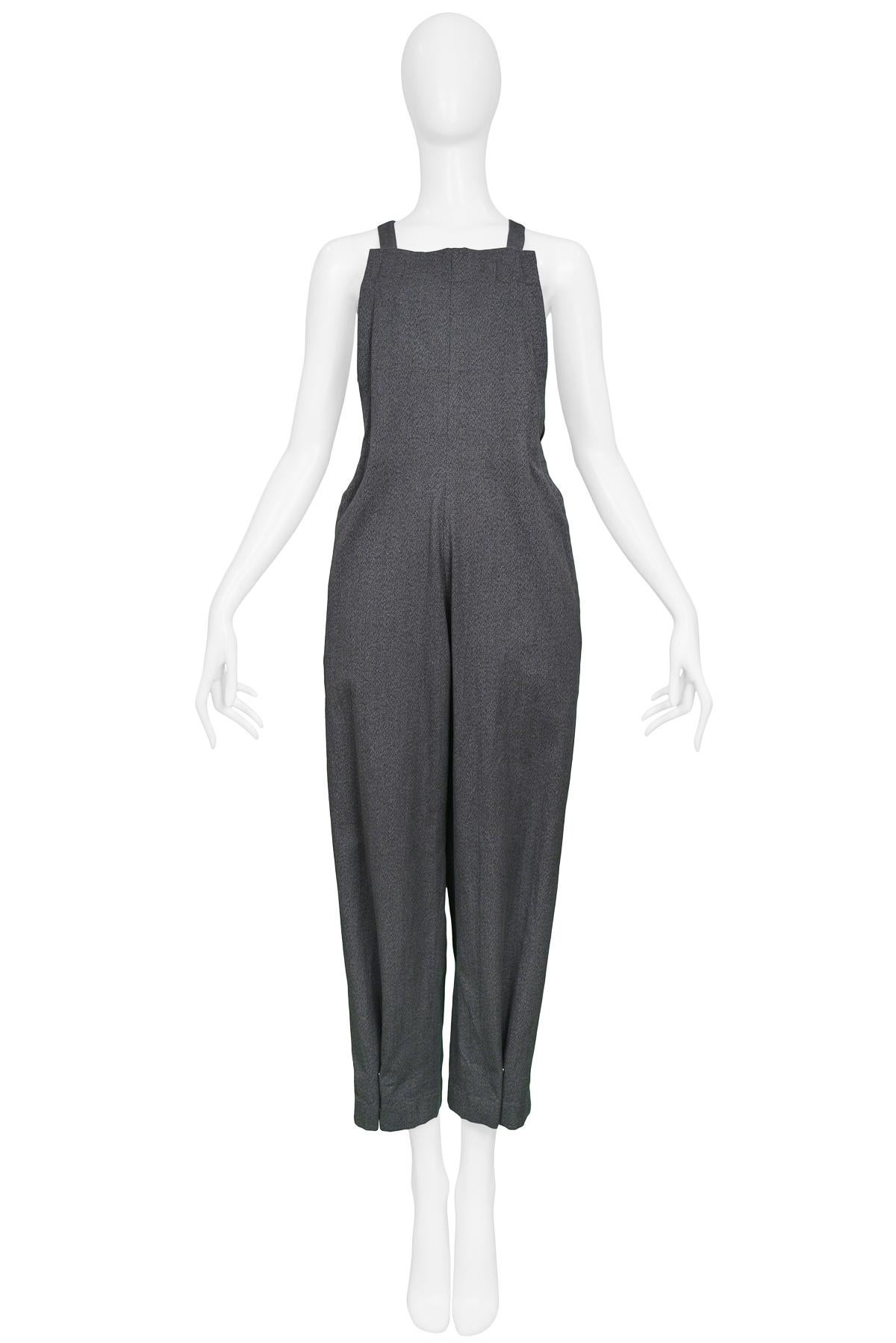 Resurrection Vintage is excited to present a vintage Yohji Yamamoto Jumpsuit featuring crossed adjustable straps, back pockets, and pleats at the ankles.

Yohji Yamamoto
Size: Small
Fabric: Cotton
Excellent Vintage Condition 
Authenticity Guaranteed 