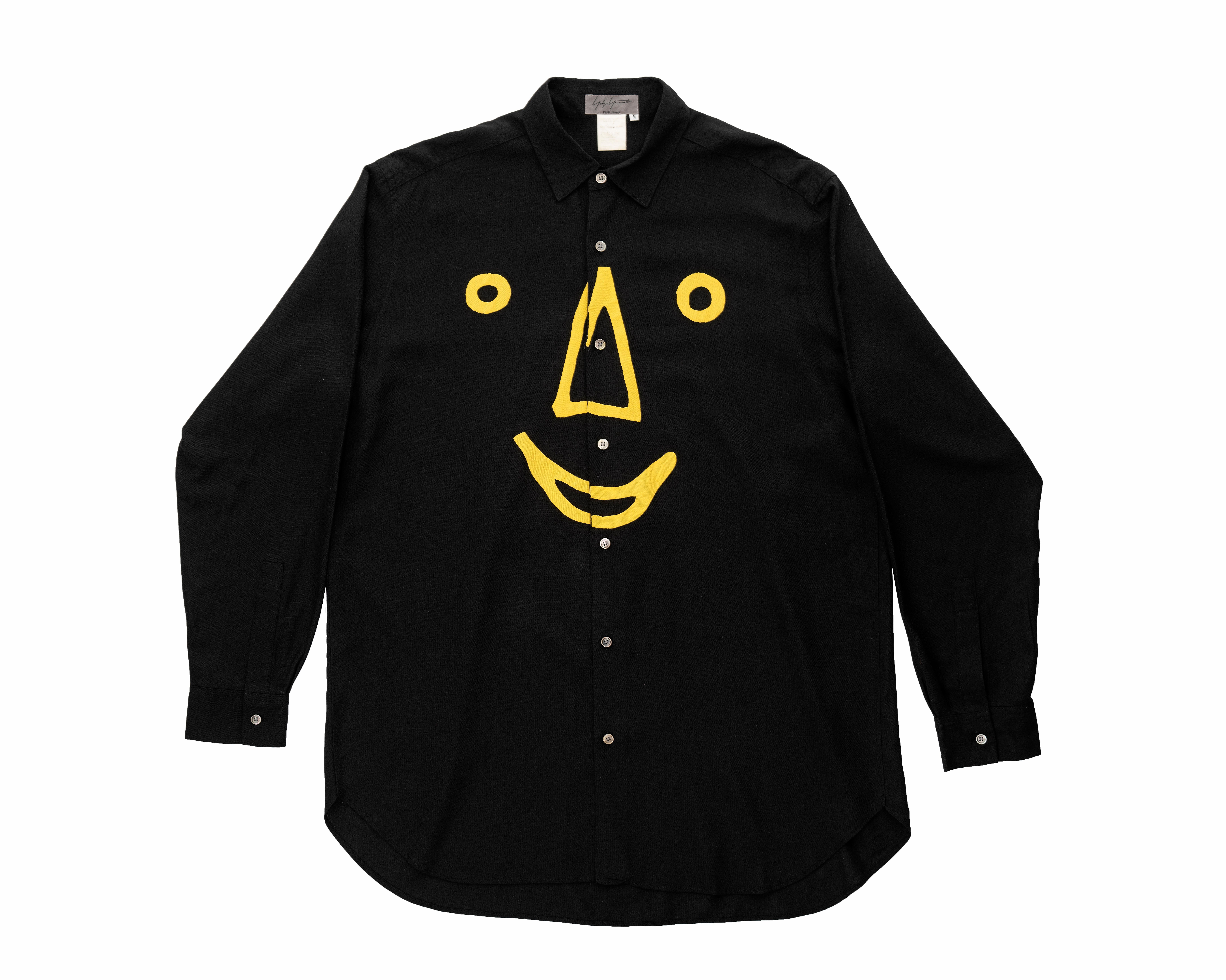 ▪ Yohji Yamamoto Homme rare black rayon shirt
▪ Sold by One of a Kind Archive
▪ Fall-Winter 1991
▪ Appliquéd yellow smiley face
▪ Loose fit 
▪ Classic collar 
▪ Size Medium
▪ Made in Japan

All photographs in this listing EXCLUDING any reference or