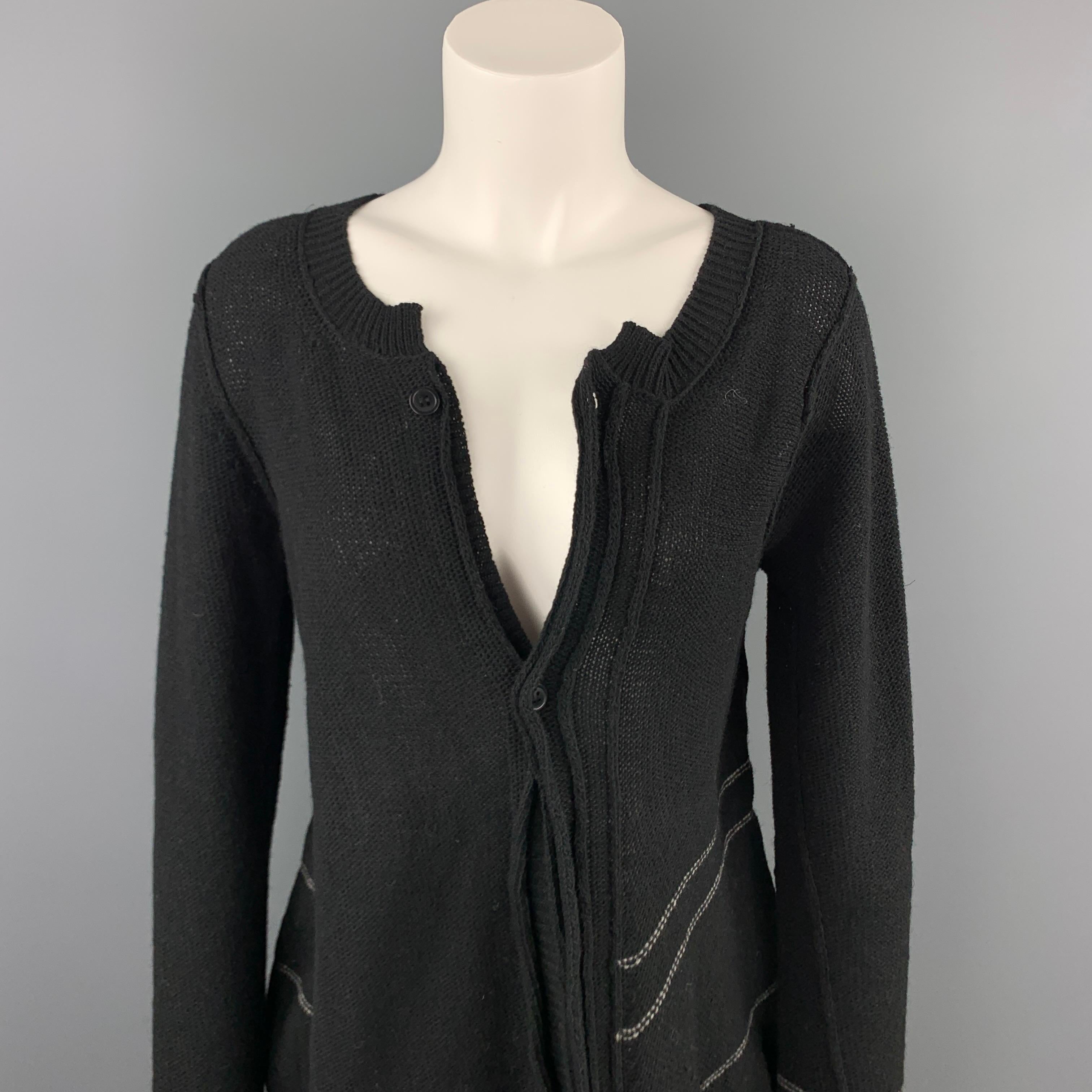 YOHJI YAMAMOTO NOIR cardigan comes in a black knitted wool with a white stripe detail featuring an asymmetrical design and a buttoned closure. 

Very Good Pre-Owned Condition.
Marked: 2

Measurements:

Shoulder: 15 in. 
Bust: 34 in. 
Sleeve: 29 in.