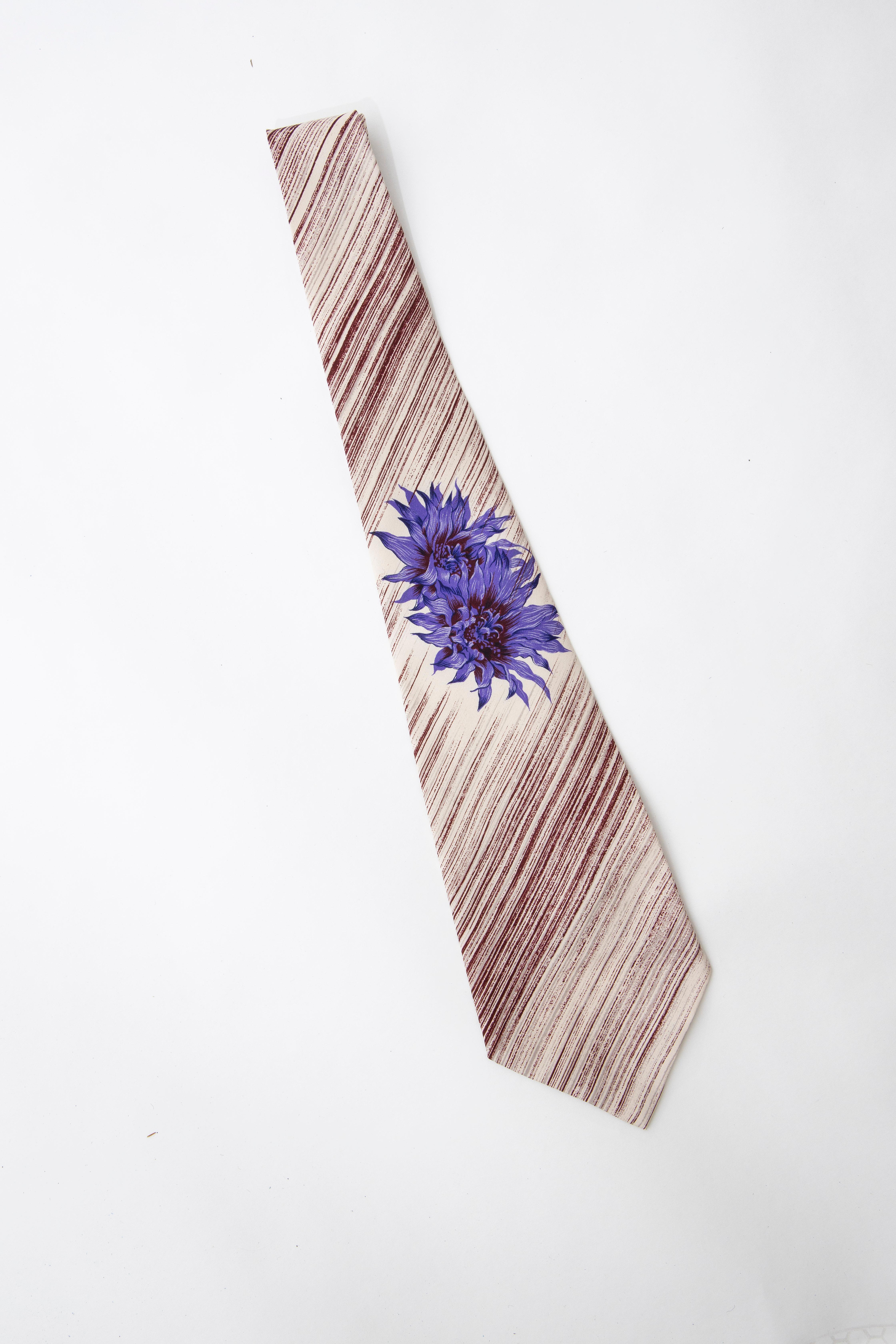 Yohji Yamamoto Pour Homme, Circa: 1980's  silk printed tie with striped and floral pattern throughout. 

Charivari Tags 

Length: 50
