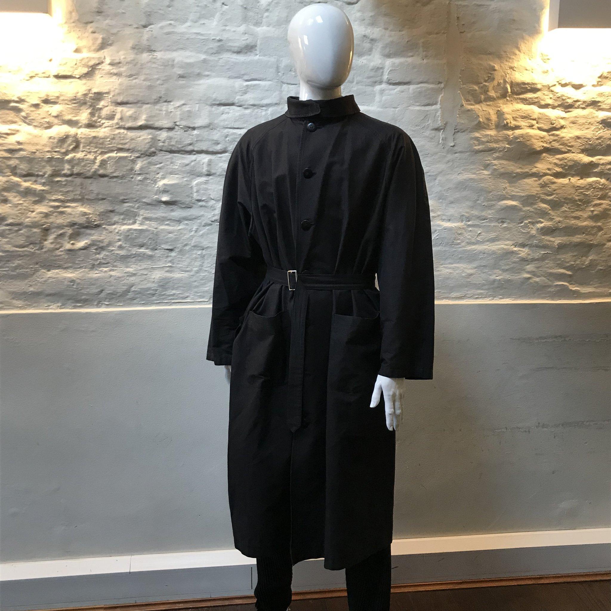 Yohji Yamamoto Raincoat made in Japan, waterproof from cotton.

Yohji Yamamoto is known for the avant-garde spirit of his clothing. His signature oversized silhouettes in black often feature drapery in varying textures. Since the establishment of