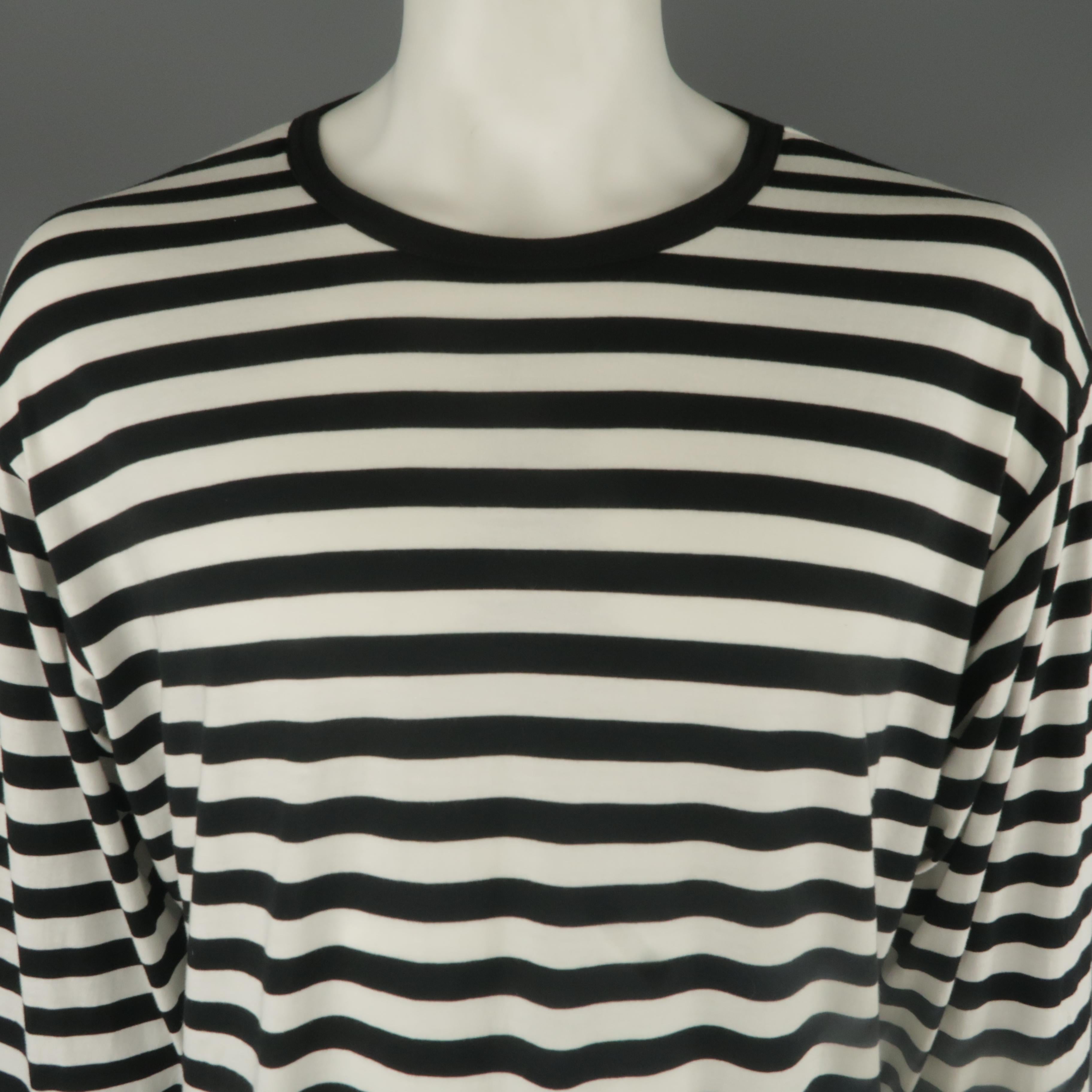 YOHJI YAMAMOTO T-shirt comes in black and white striped cotton viscose jersey with a crewneck and logo 