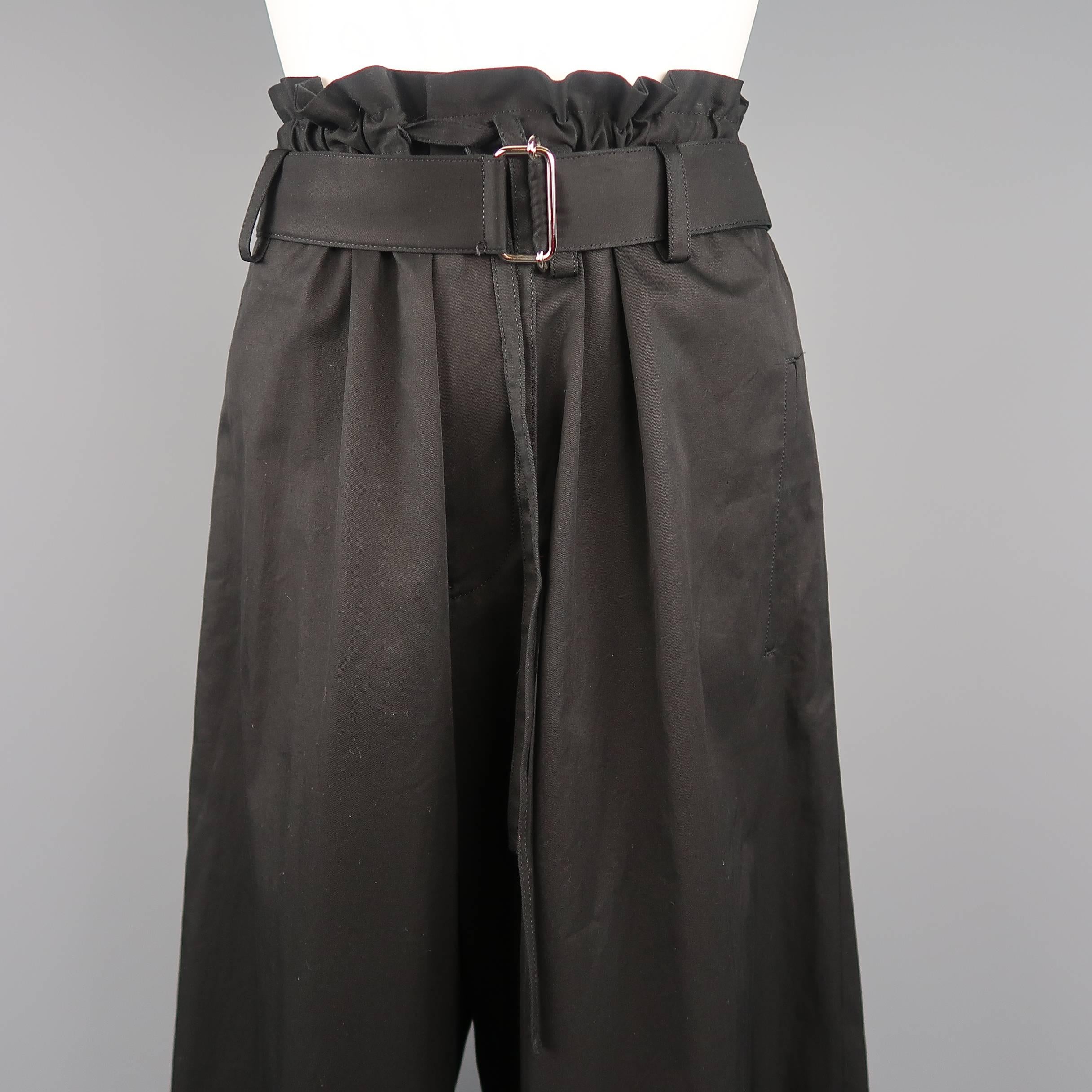 Yohji Yamamoto + Noir pants come in a light weight cotton poplin with a gathered drawstring waist with belt and dramatic wide leg. Made in Japan.
 
Excellent Pre-Owned Condition.
Marked: JP 2
 
Measurements:
 
Waist: 34 in.