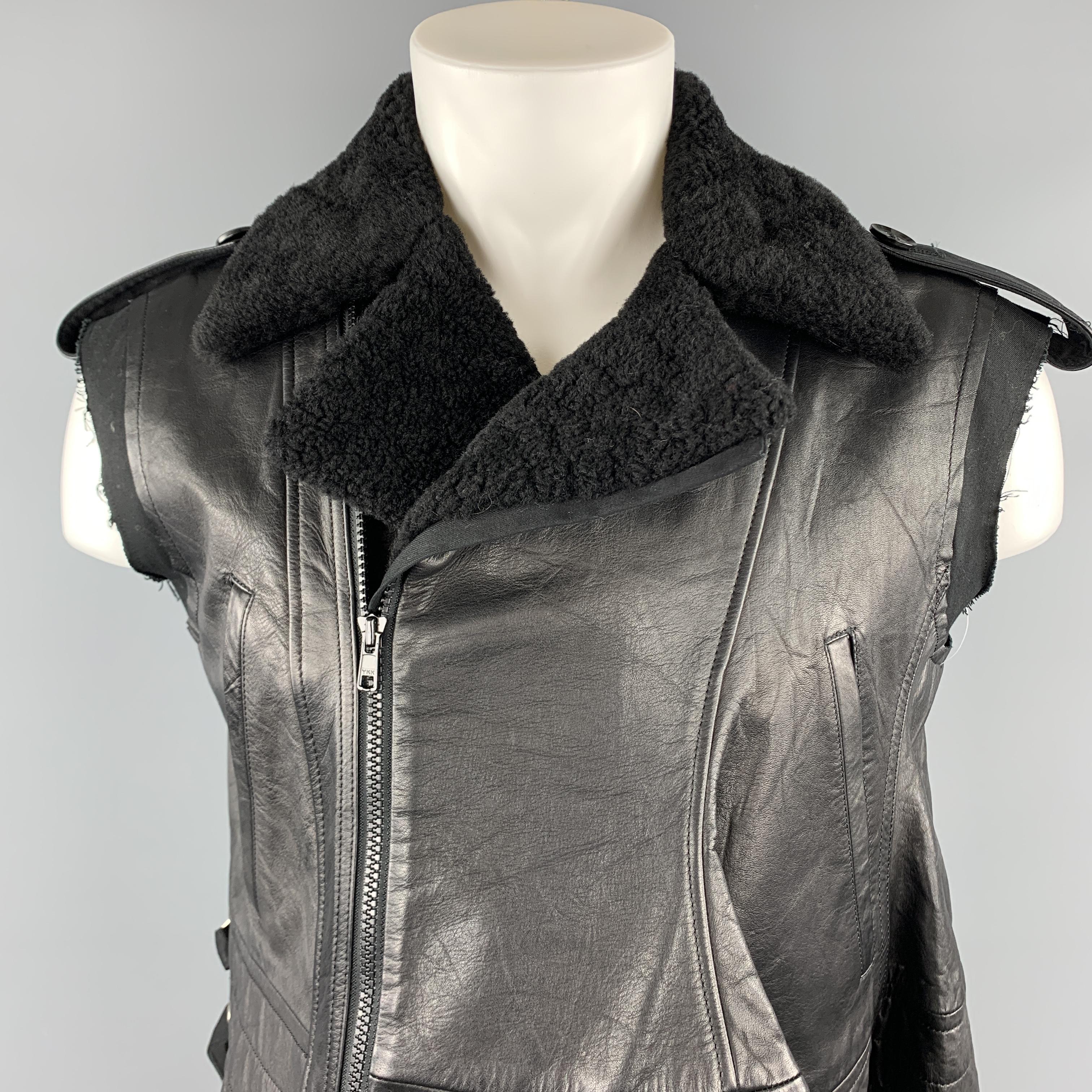 Women's YOHJI YAMAMOTO vest comes in a black sheep skin leather featuring a biker style, distressed cut sleeves, contrast stitching, slit pockets, and a full zip closure. Made in Japan. 

Excellent Pre-Owned Condition.
Marked: JP