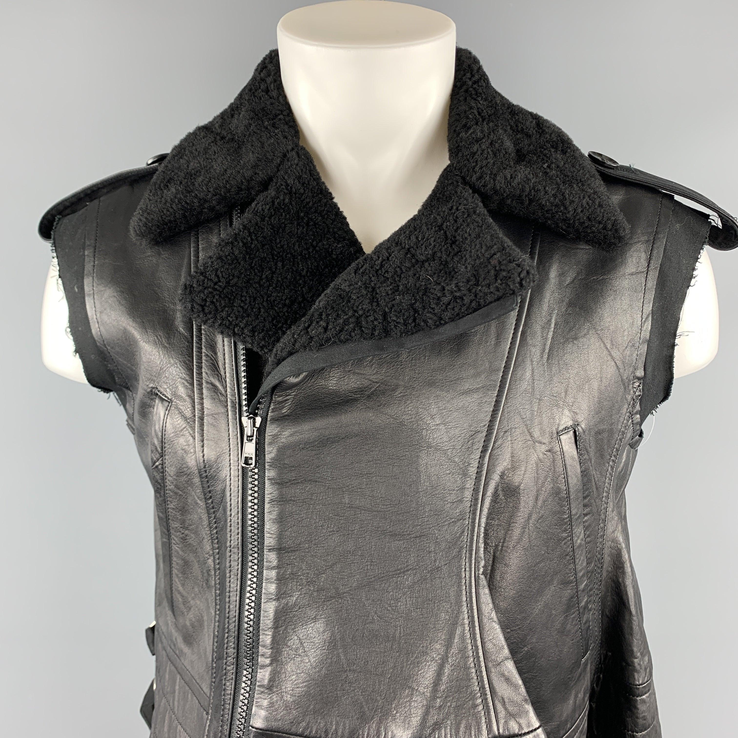 Women's YOHJI YAMAMOTO vest comes in a black sheep skin leather featuring a biker style, distressed cut sleeves, contrast stitching, slit pockets, and a full zip closure. Made in Japan.
Excellent
Pre-Owned Condition. 

Marked:   JP 2 

Measurements: