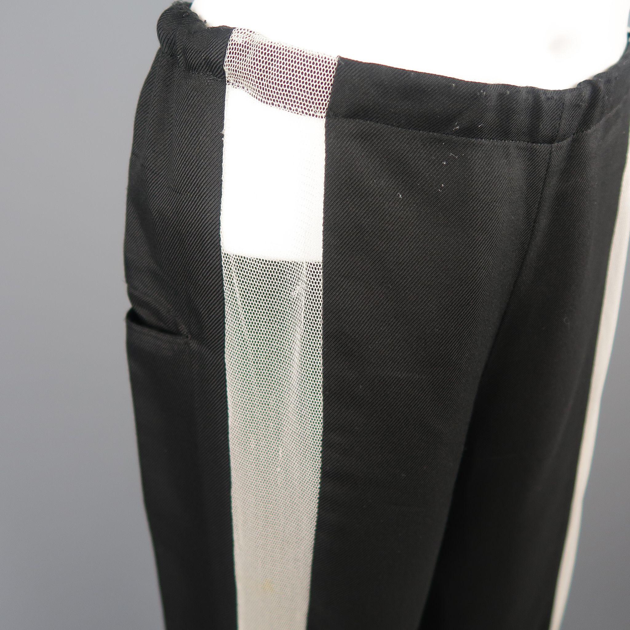 YOHJI YAMAMOTO dress pants come in silk in black tone with white mesh front detail, lateral pockets and drawstring closure, with signals of wear throughout.  Made in Japan.

Fair Pre-Owned Condition.
Marked: JP 2

Measurements:

Waist: 35 in.
Rise: