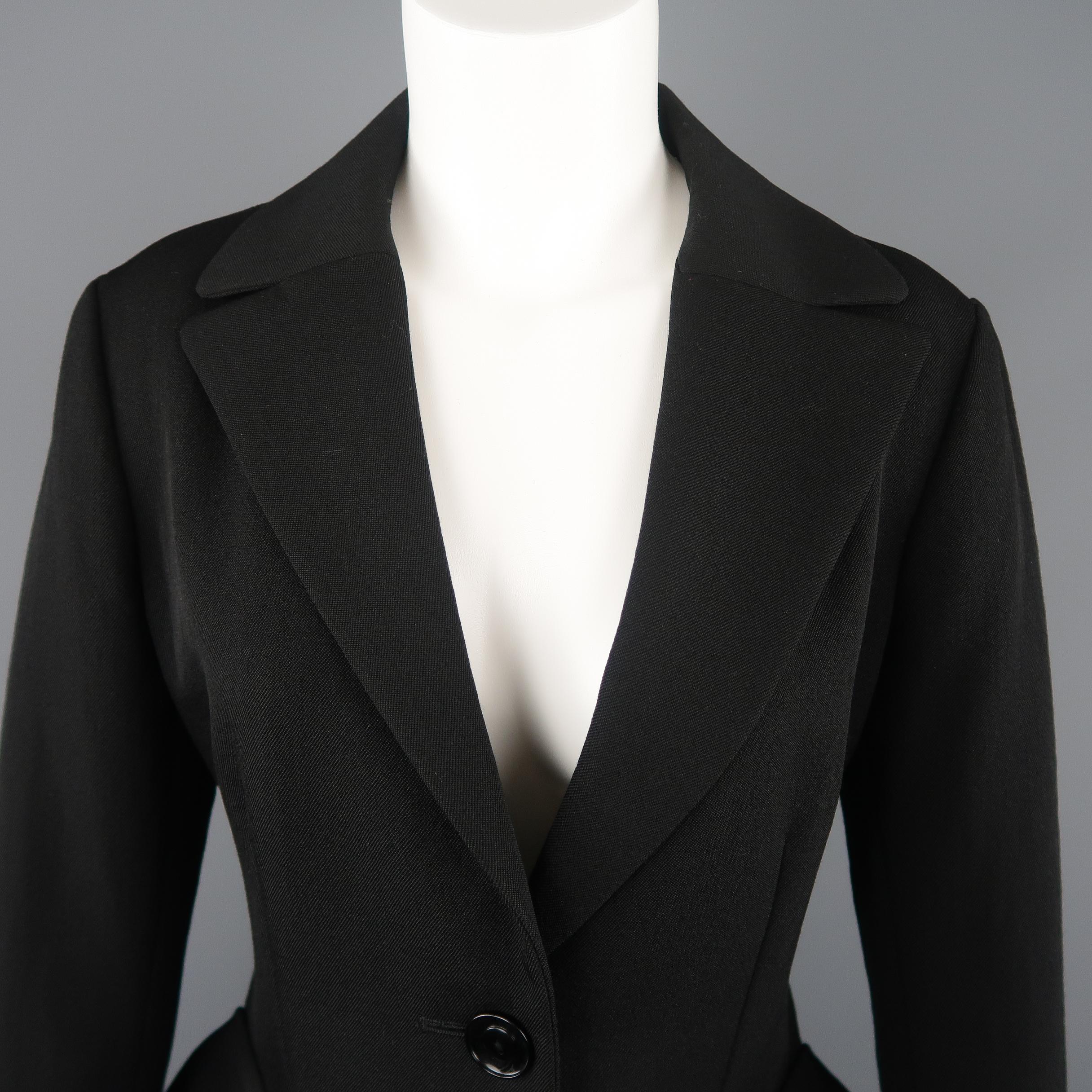 YOHJI YAMAMOTO blazer jacket comes in black wool twill with a pointed lapel, three button single breasted front, and oversized flap patch military style pockets that zip off. Circa 2004. Made in Japan. On display at Victoria and Albert Museum.
