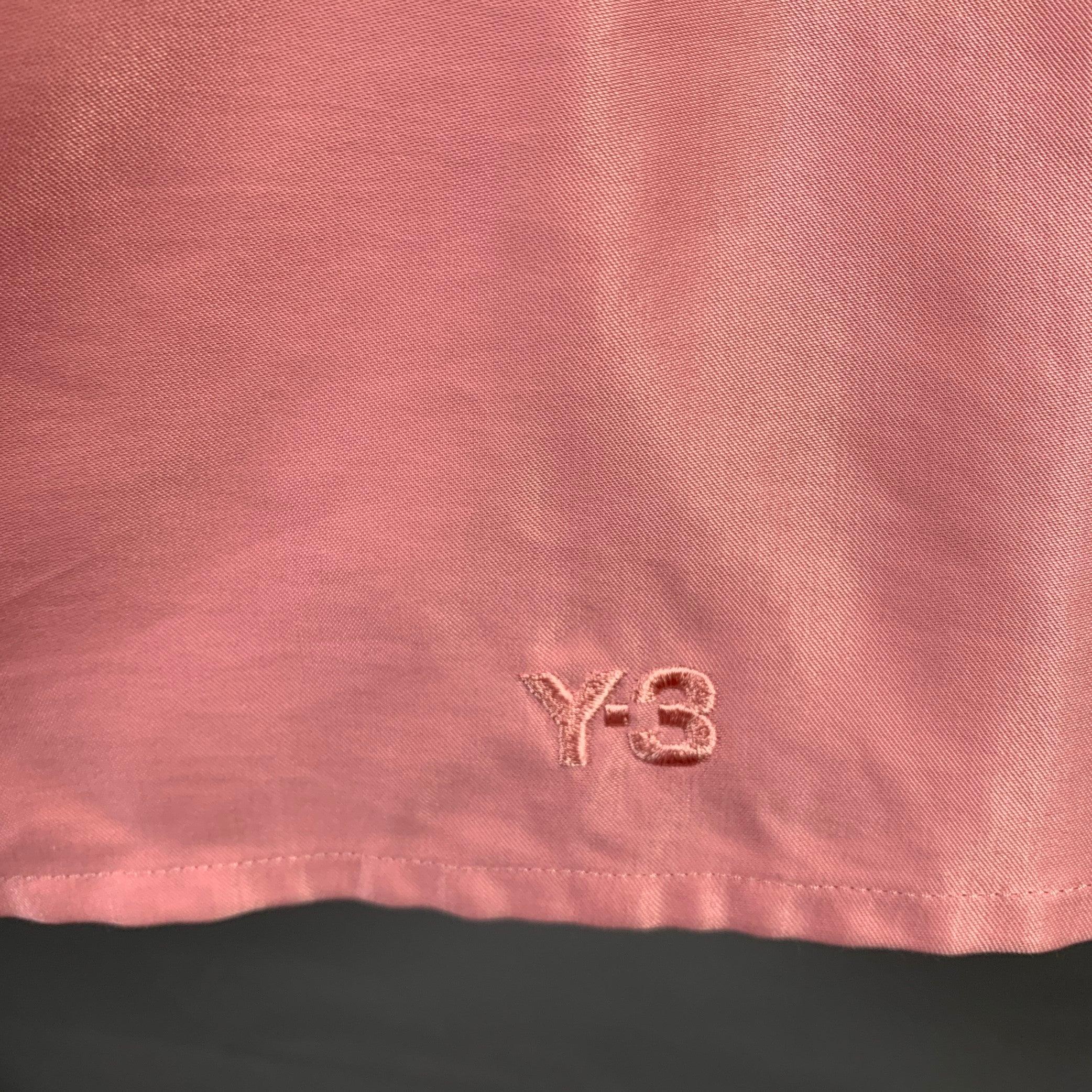 YOHJI YAMAMOTO Y-3 skirt comes in pink sateen women material features a ziper pocket, A-line silhouette, and a zip up closure at back. Very Good Pre-Owned Condition. Signs of wear. 

Marked:   M 

Measurements: 
  Waist: 31 inches Hip: 39 inches