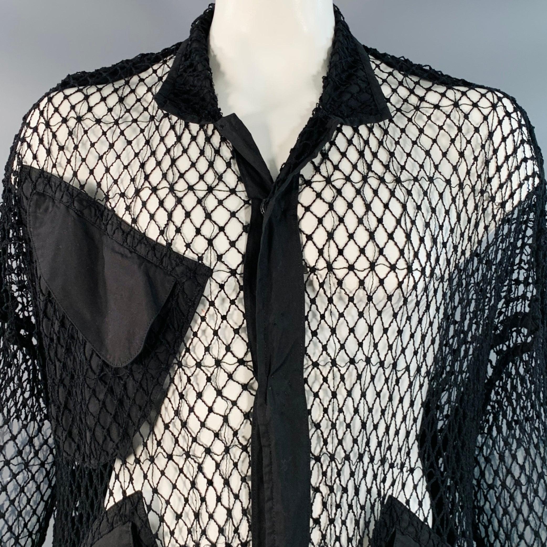 B by YOHJI YAMAMOTO coat
in a black cotton woven fabric featuring a fishnet mesh overlay, three flap pockets, and double snap closure. Made in Japan.Very Good Pre-Owned Condition. Minor signs of wear. 

Marked:   JP 1 

Measurements: 
 
Shoulder: 16