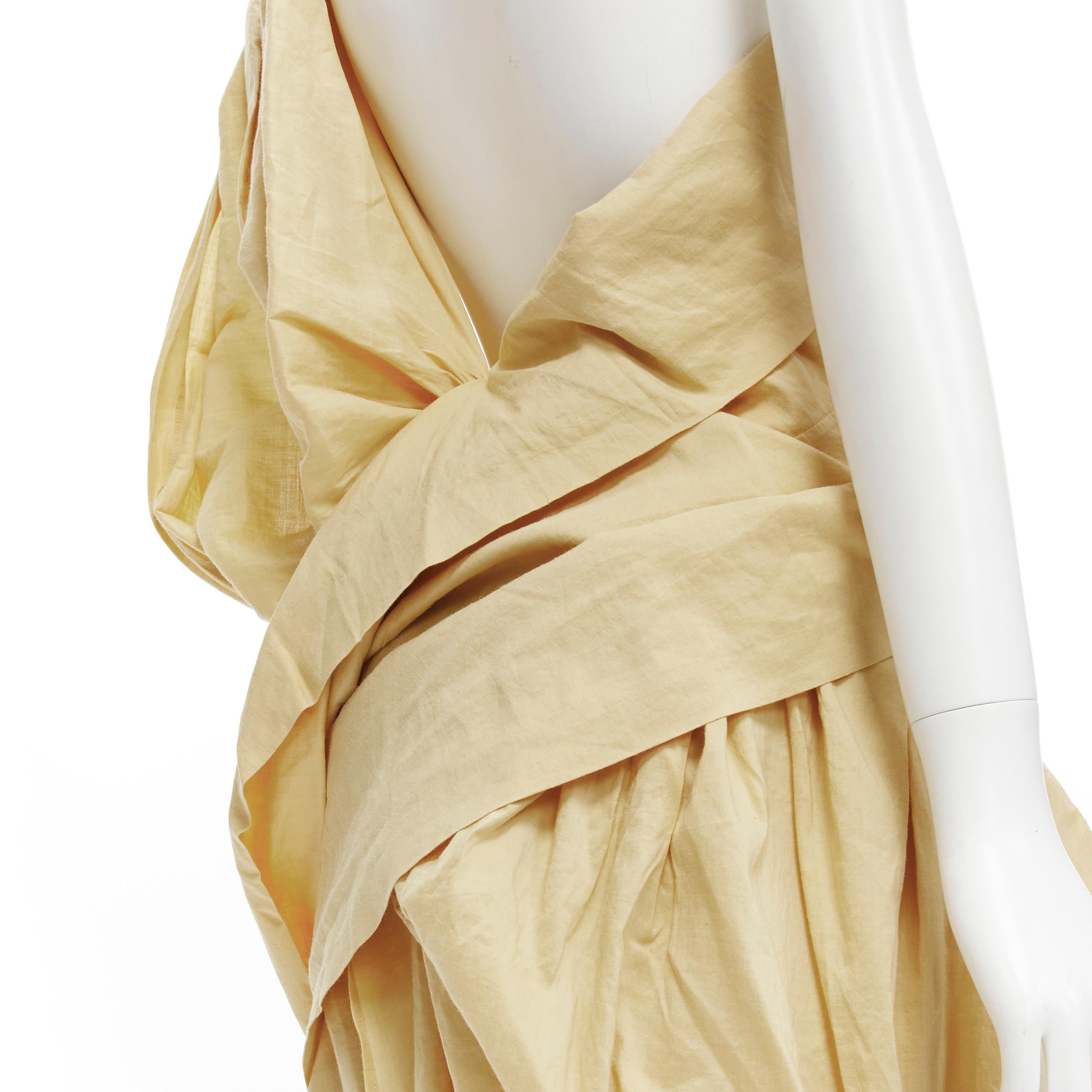 YOHJI YAMAMOTO Vintage 1980s beige draped panel skirt wrap sash dress M 
Reference: CRTI/A00573 
Brand: Yohji Yamamoto 
Collection: 1980's 
Material: Linen 
Color: Beige 
Pattern: Solid 
Closure: Button 
Extra Detail: Button wrap skirt. Draped panel