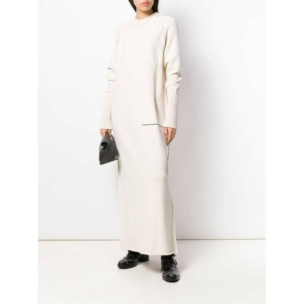 Yohji Yamamoto beige cotton 90s dress with round collar, long sleeves, ribbed cuffs, two frontal welt pockets, black details embroidered. Press studs fastening.

Size: L 

Flat measurements 
Height: 148 cm
Bust: 48 cm
Sleeves: 85 cm
Shoulders: 34