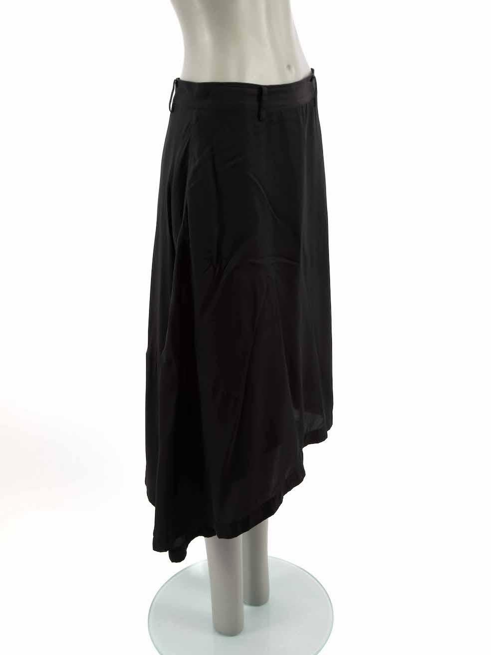 CONDITION is Good. Minor wear to skirt is evident. Light wear to fabric with negligible plucks to the weave at front on this used Y's Yohji Yamamoto designer resale item.

Details
Black
Synthetic
Asymmetric skirt
Midi length
Belt hoops
Side zip