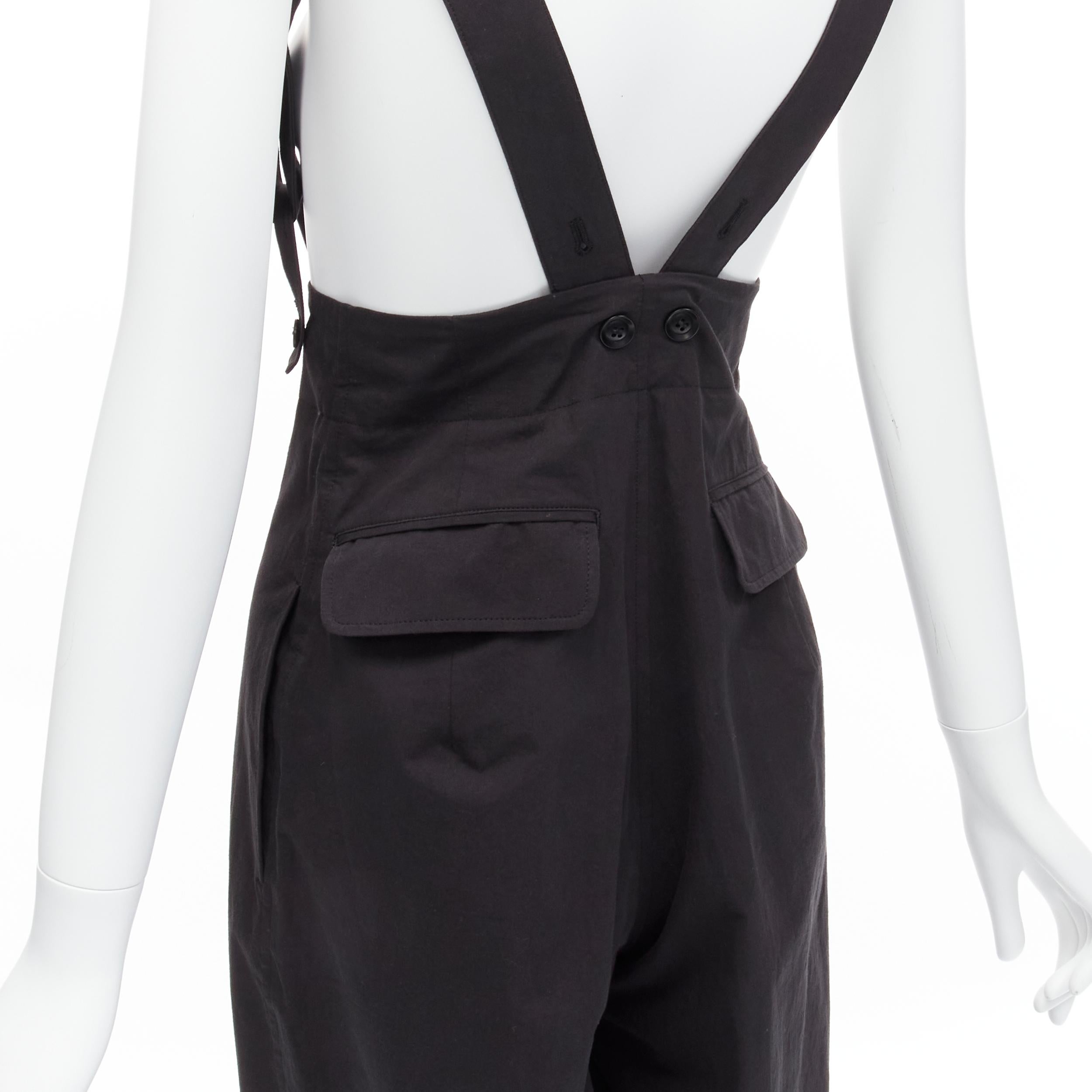 YOHJI YAMAMOTO Y'S black minimal beggar suspender dungaree wide leg pants JP1 S
Reference: TGAS/D00225
Brand: Yohji Yamamoto
Collection: Y'S
Material: Cotton
Color: Black
Pattern: Solid
Closure: Zip Fly
Extra Details: Adjustable straps.
Made in: