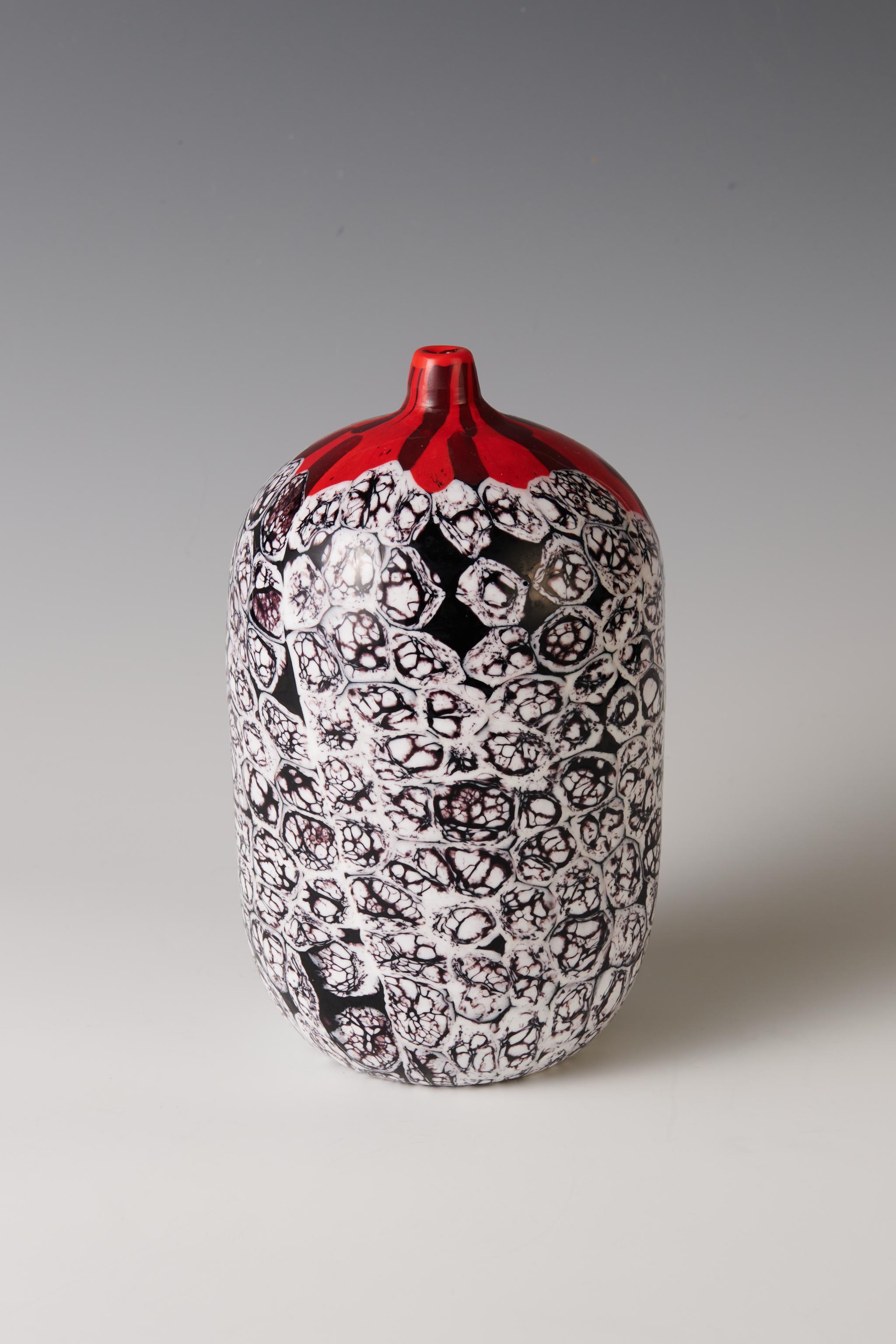 A unique 'Finestre Rosse' vase, 2001 by Yoichi Ohira

Italy, 2001
hand-blown glass canes with powder and grain inserts
27 x 15 cm
Excellent condition

This unique work was executed by Maestro Livio Serena and Maestro Giacomo Barbini. Etched