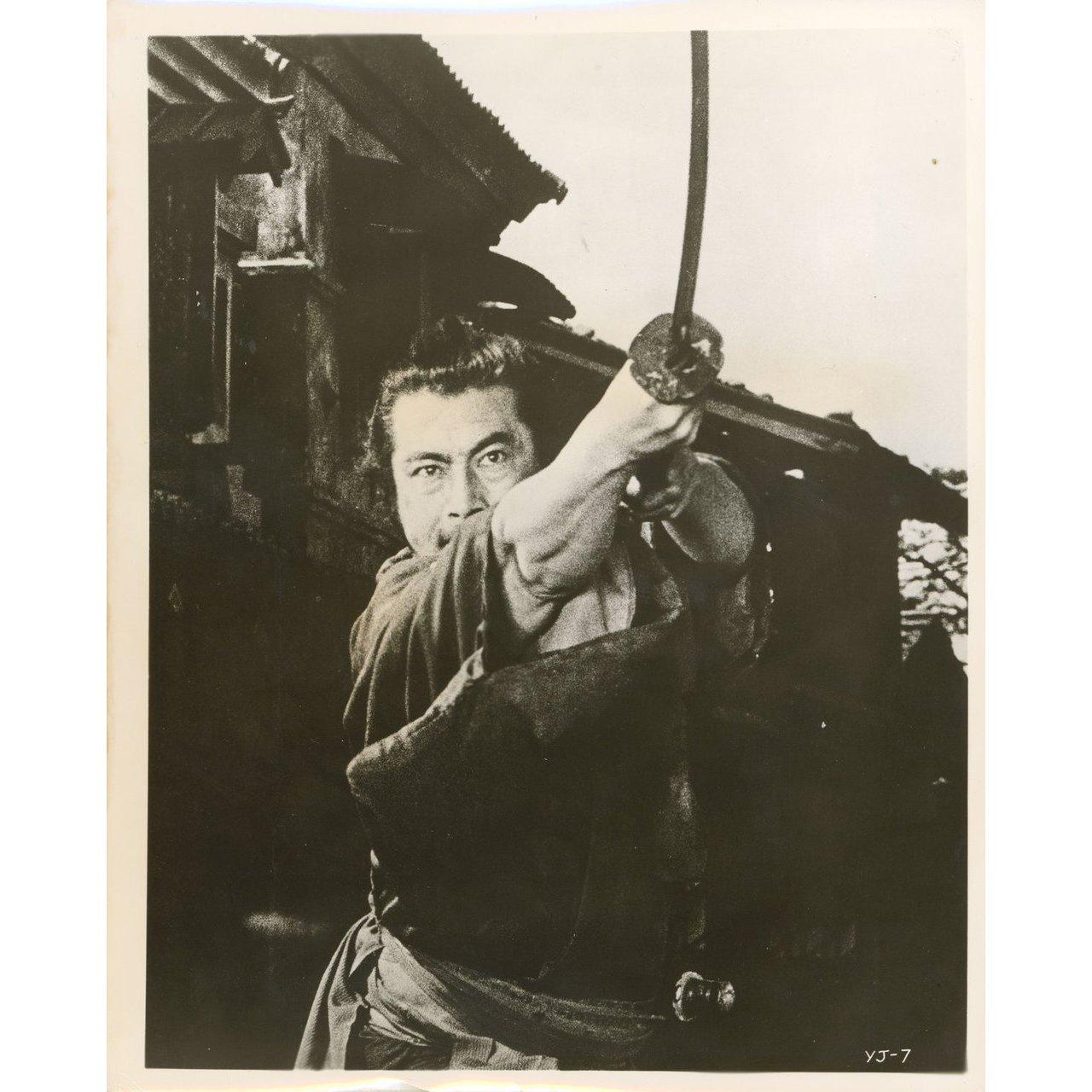 Original 1961 U.S. silver gelatin single-weight photo for the film Yojimbo directed by Akira Kurosawa with Toshiro Mifune / Tatsuya Nakadai / Yoko Tsukasa / Isuzu Yamada. Very good-fine condition, curling. Please note: the size is stated in inches